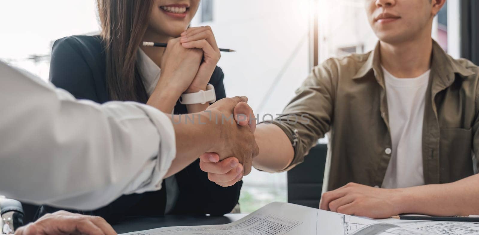 Success deal, Meeting and greeting for project of partner. Construction engineering, architect worker team or partnership hands shaking, handshake after agreement in office site, collaboration concept by wichayada