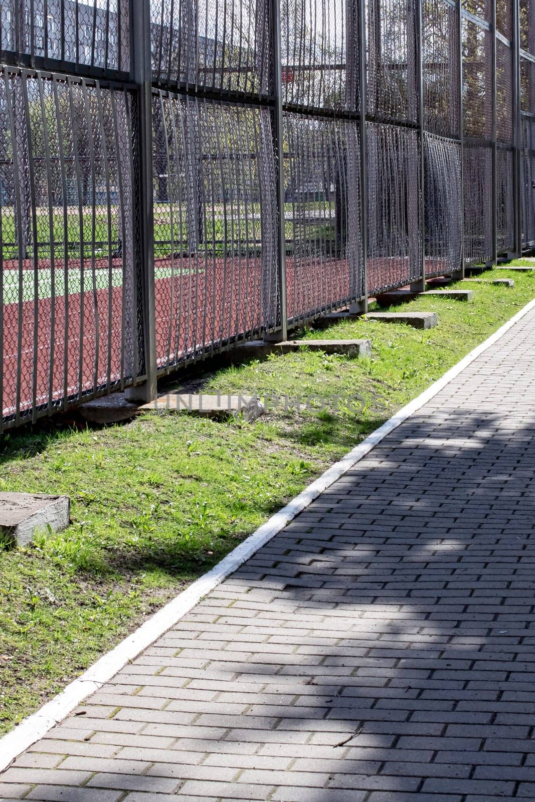 Tile alley in the park in sunlight close up