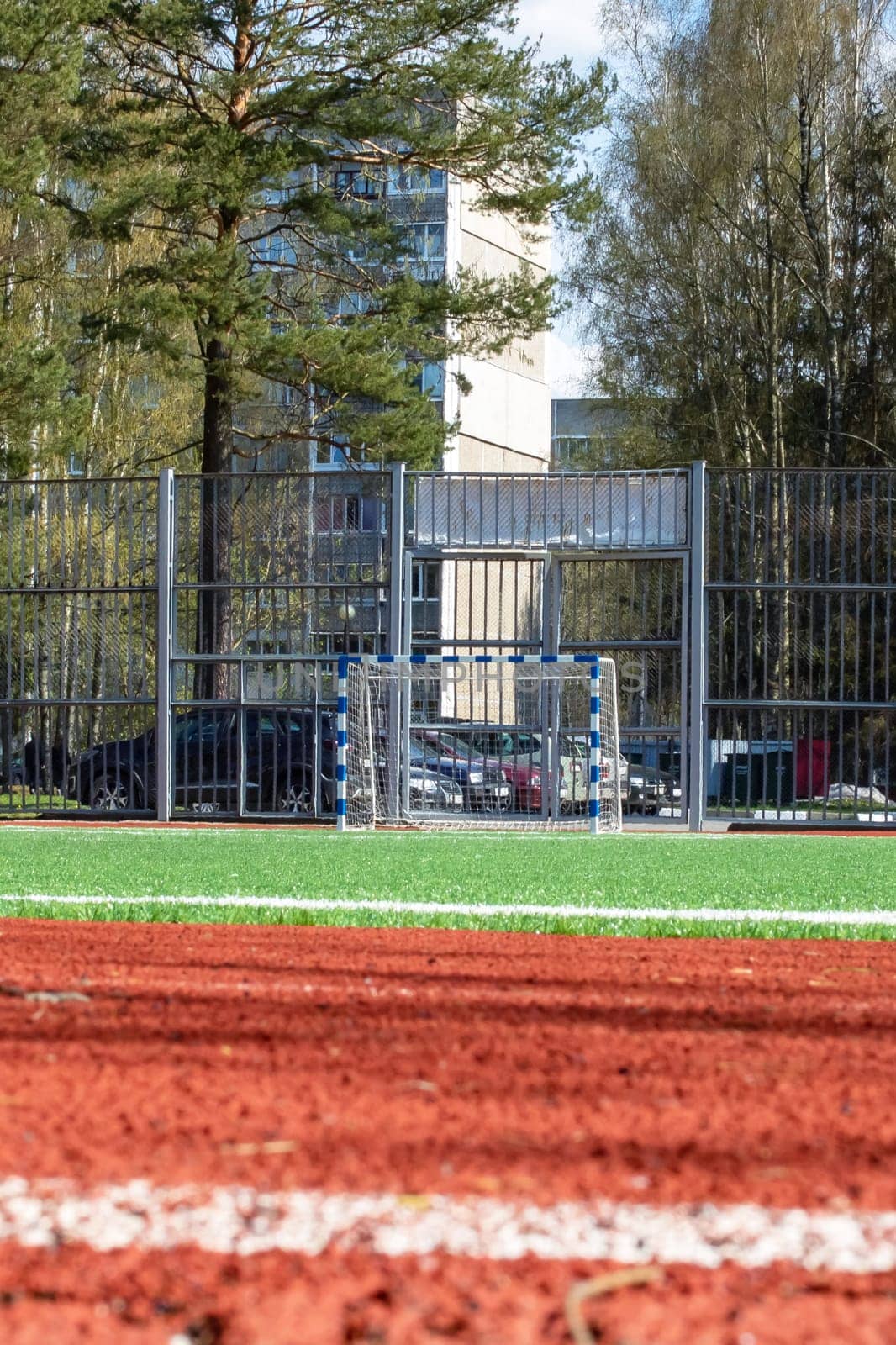 Soccer field with green grass and a treadmill close up