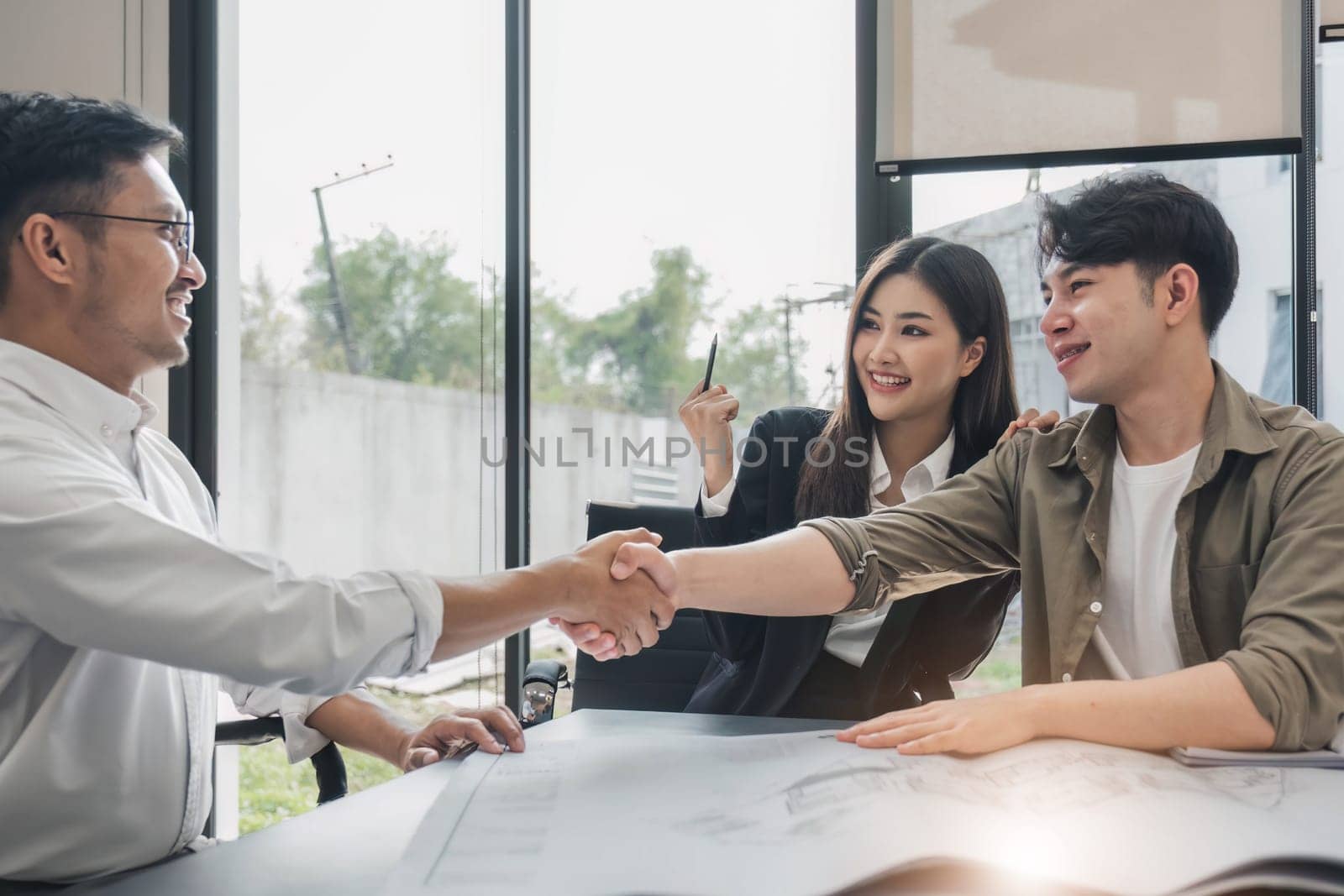 Success deal, Meeting and greeting for project of partner. Construction engineering, architect worker team or partnership hands shaking, handshake after agreement in office site, collaboration concept..