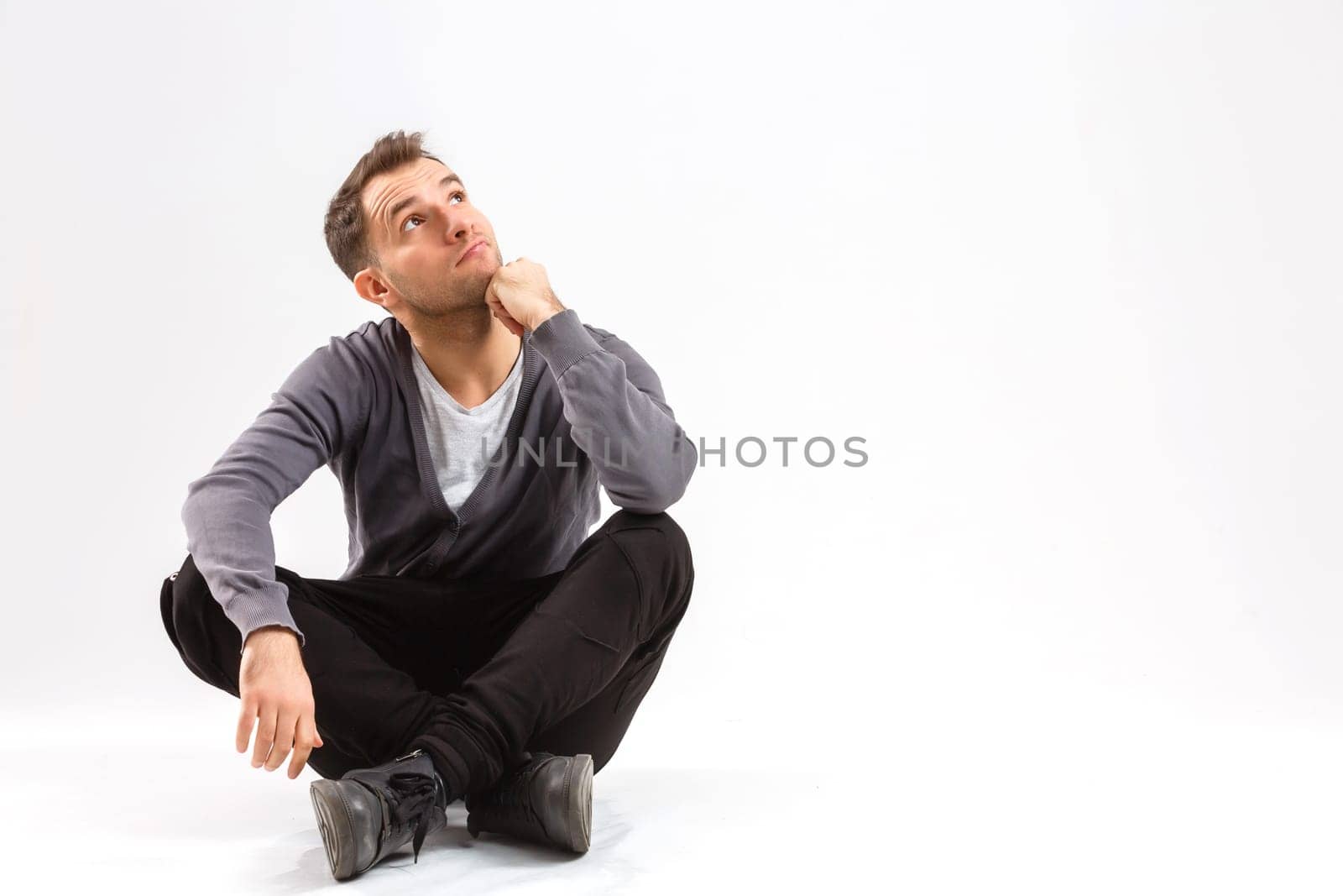 man thinking over gray background by Andelov13