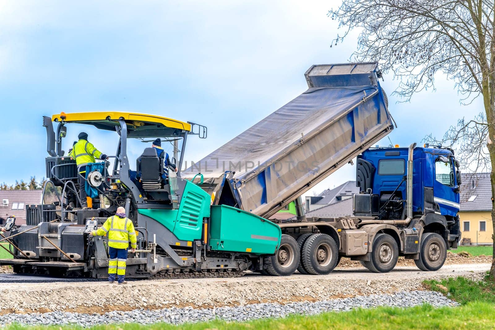 machine asphalting of roads. truck with asphalt. the creation of a new transport communication and infrastructure. High quality photo