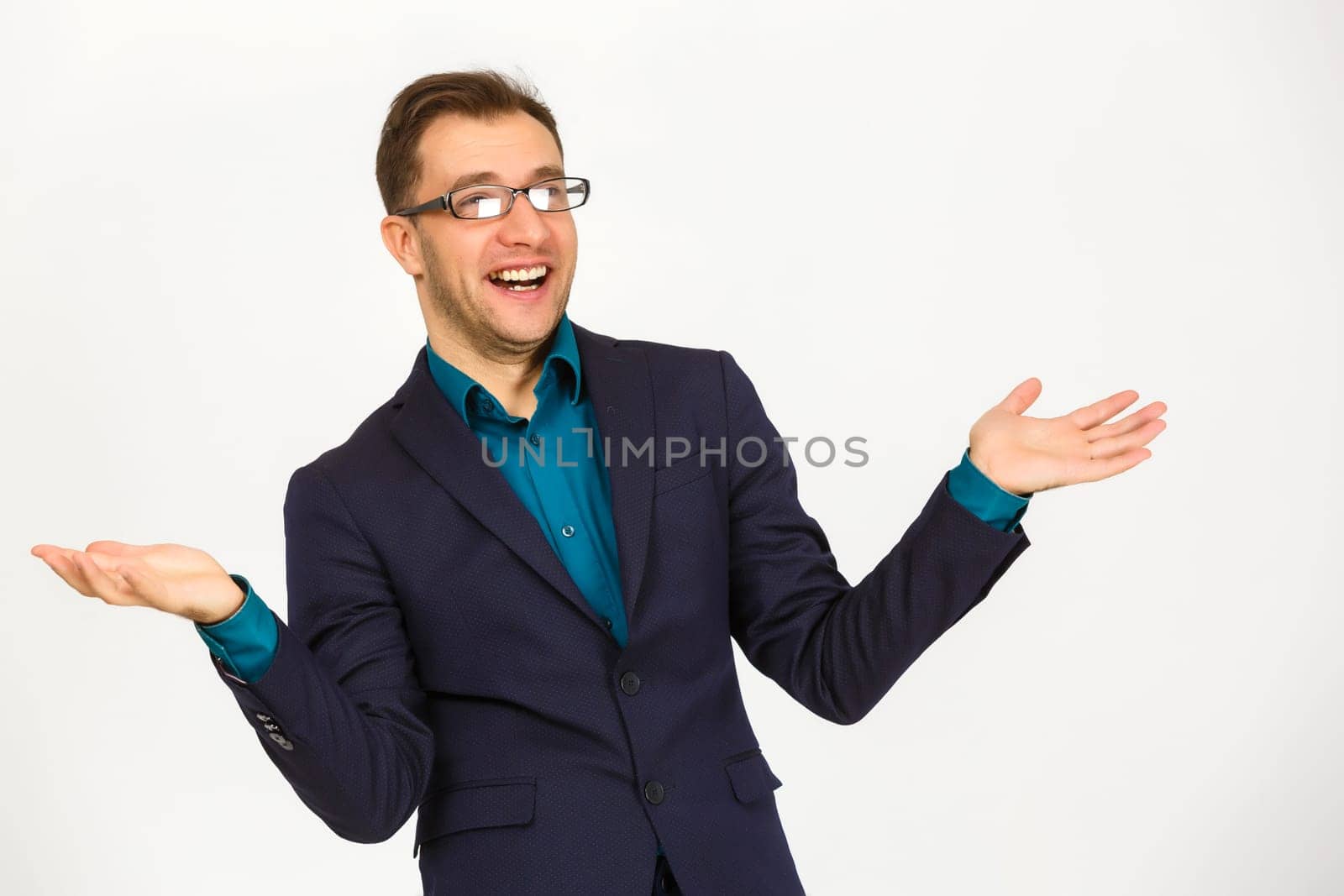 A view of a shocked young businessman isolated on white background