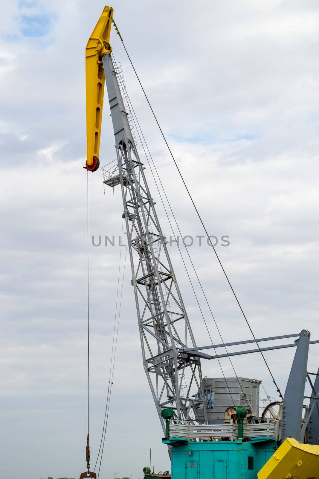 Luffing crane against of blue sky. High quality photo