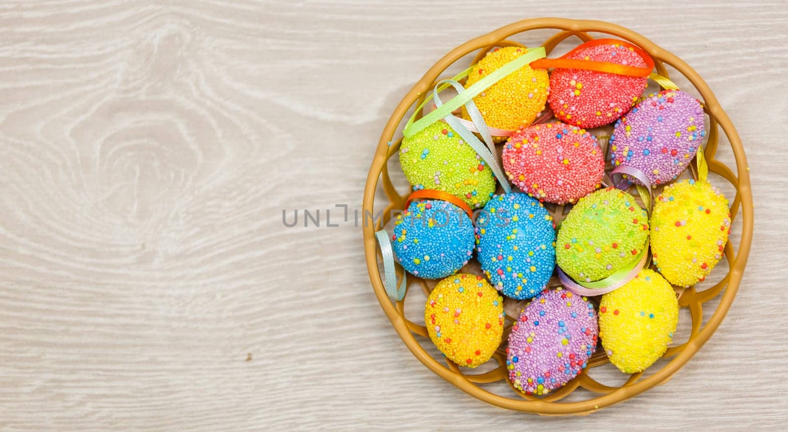 Easter eggs painted in pastel colors on a white background