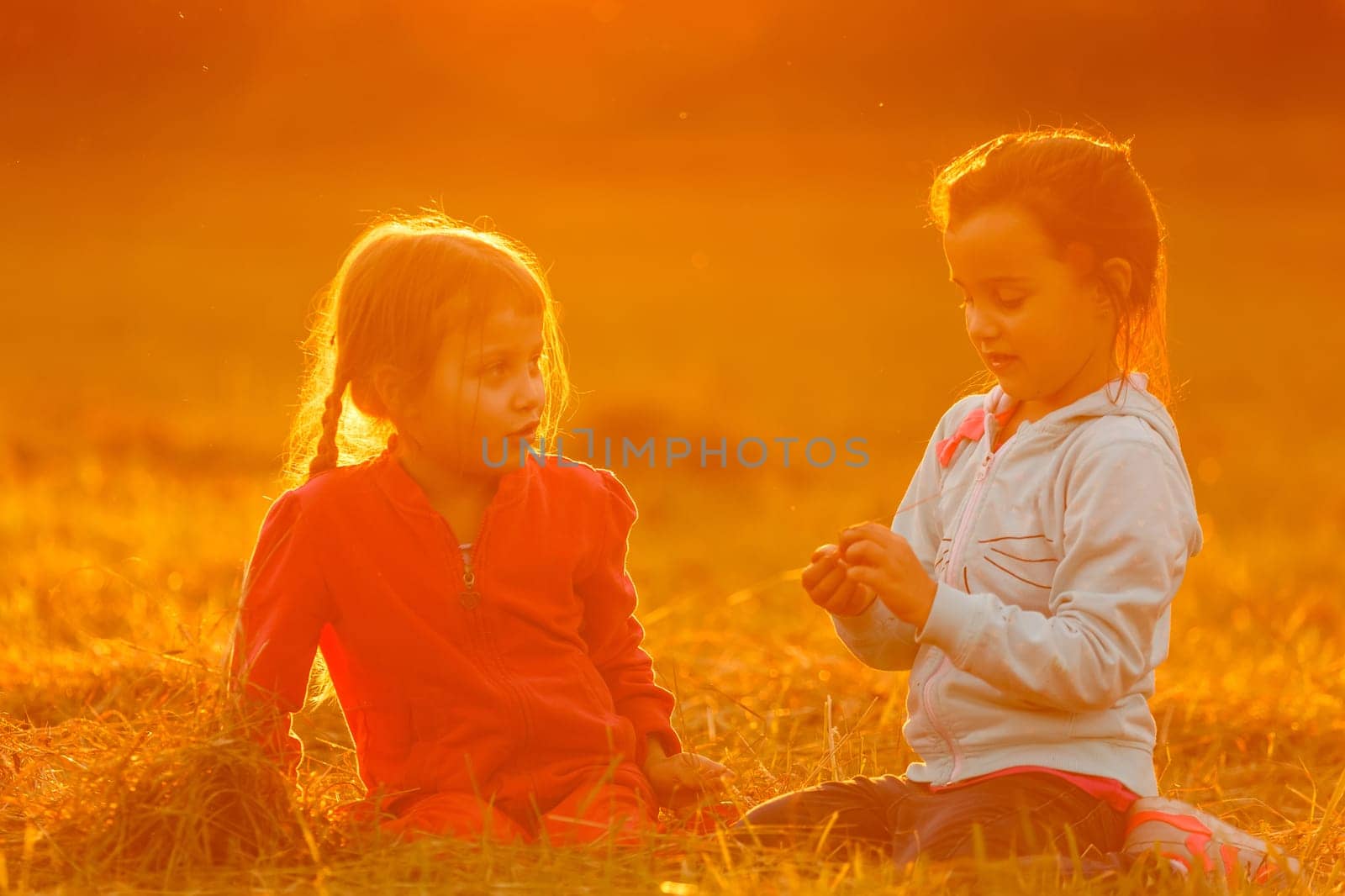 Beautiful little girls enjoying outside.
