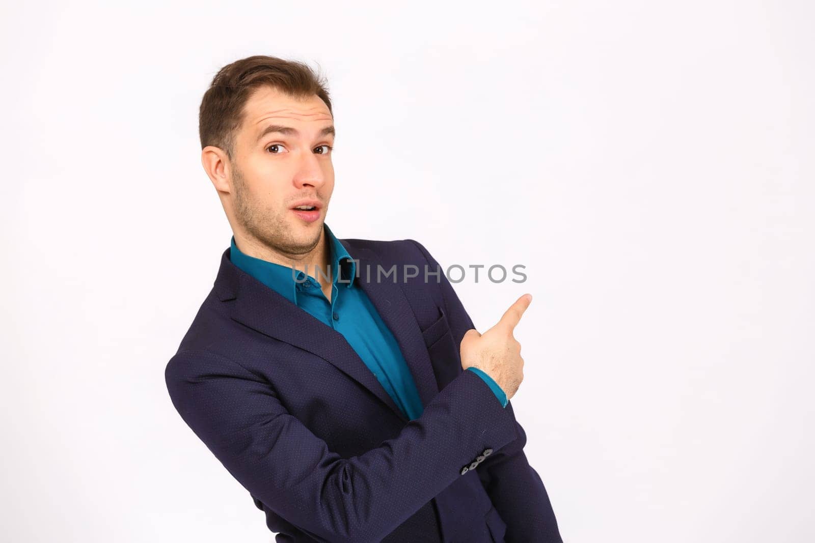 Man standing and presenting something above against white background by Andelov13