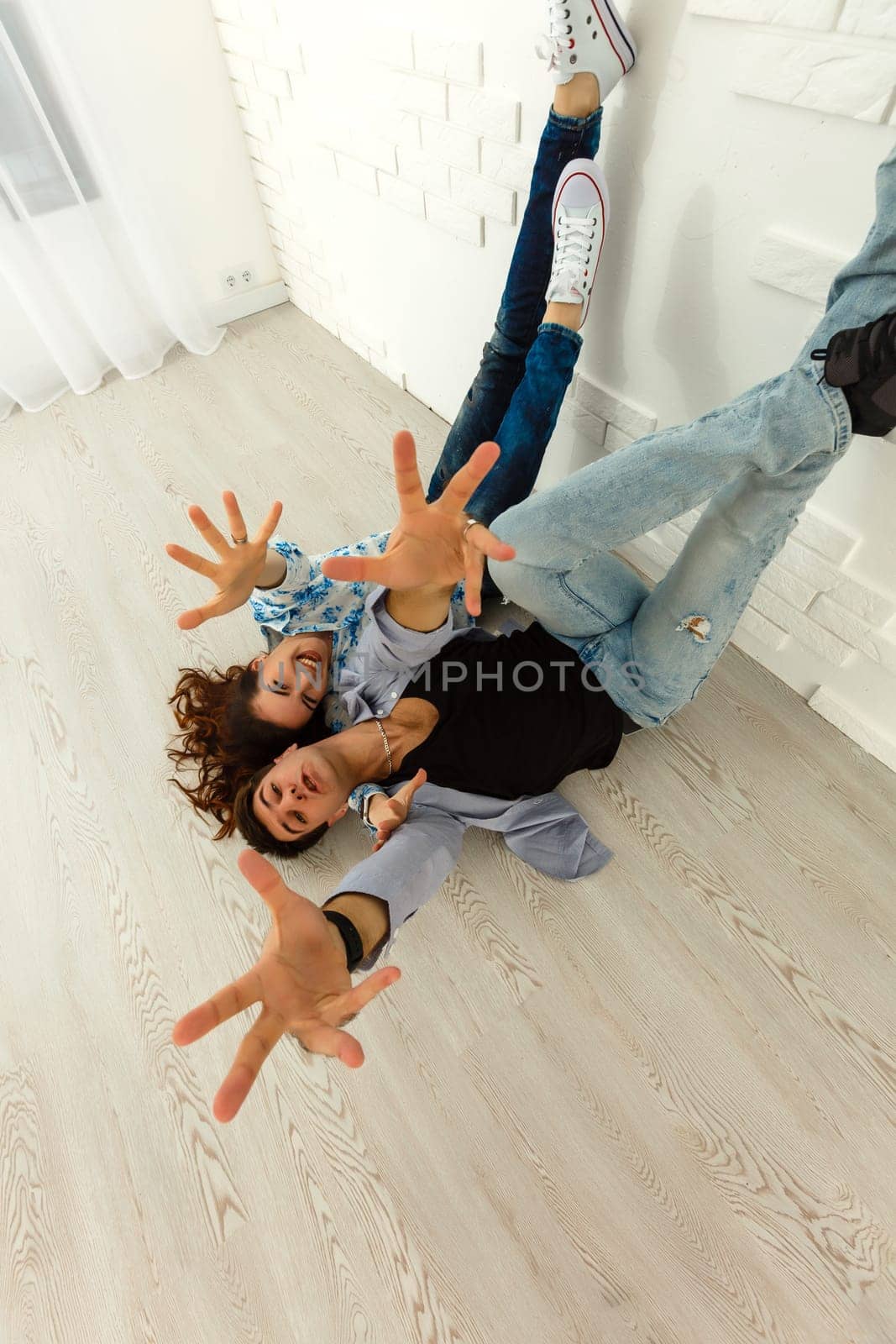 Young couple fooling around indoors.