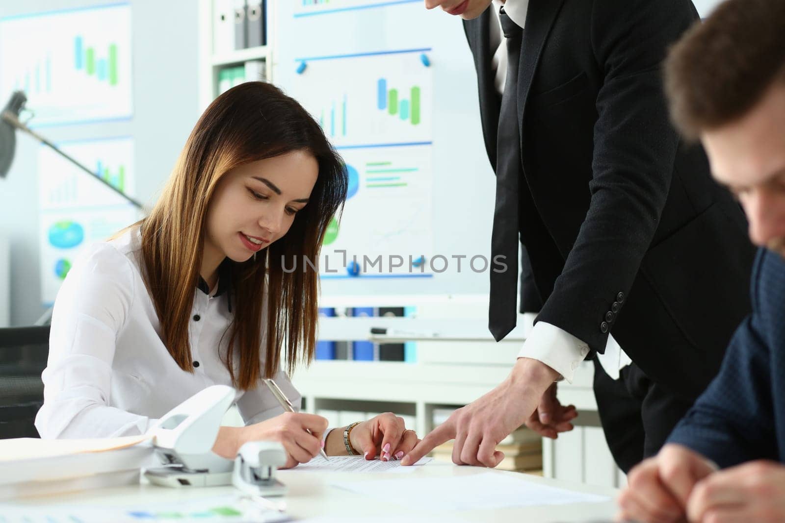 Businesswoman signs a business contract with partner. Signing a cooperation agreement concept