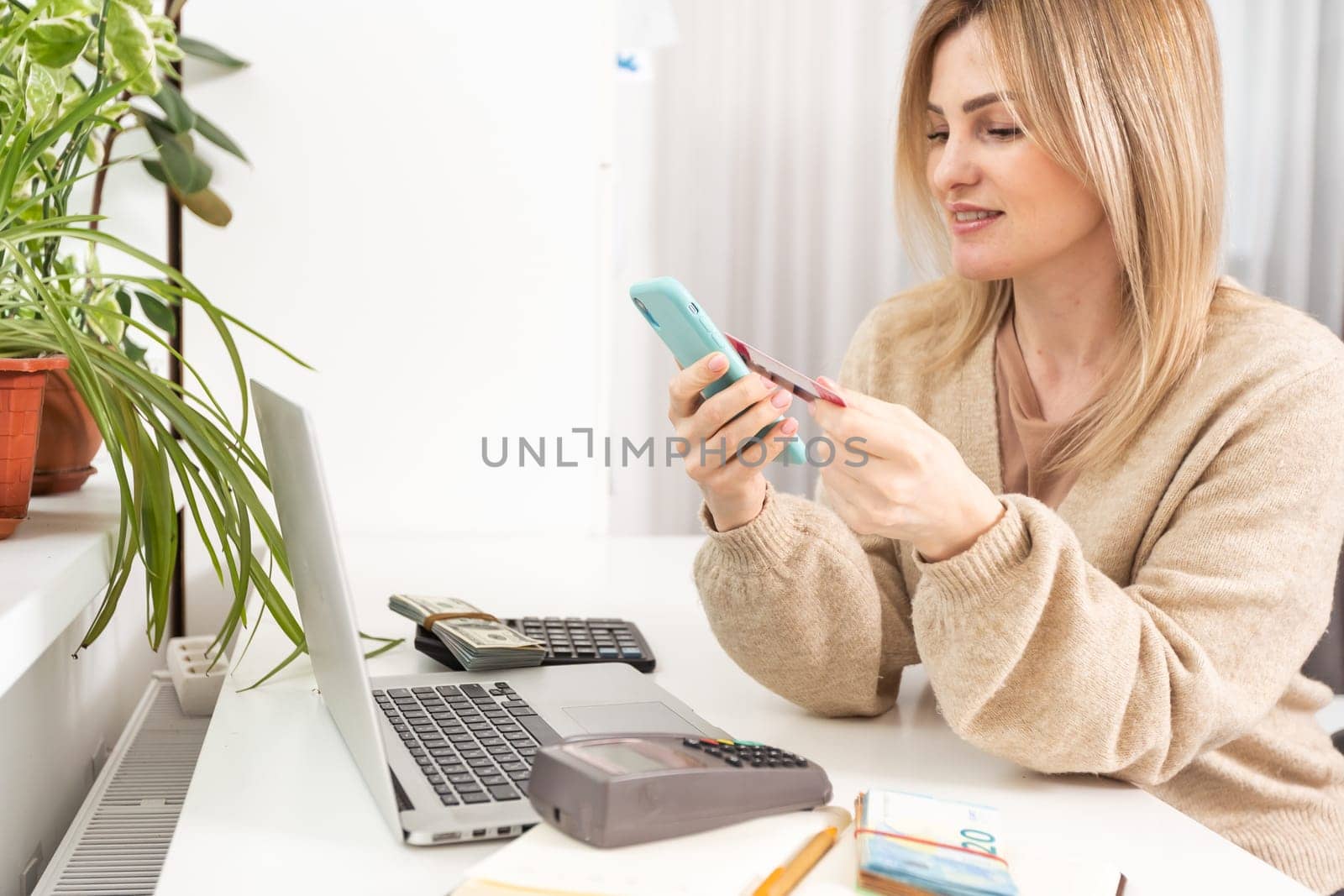Online payment, hands holding a credit card and using smart phone for online shopping