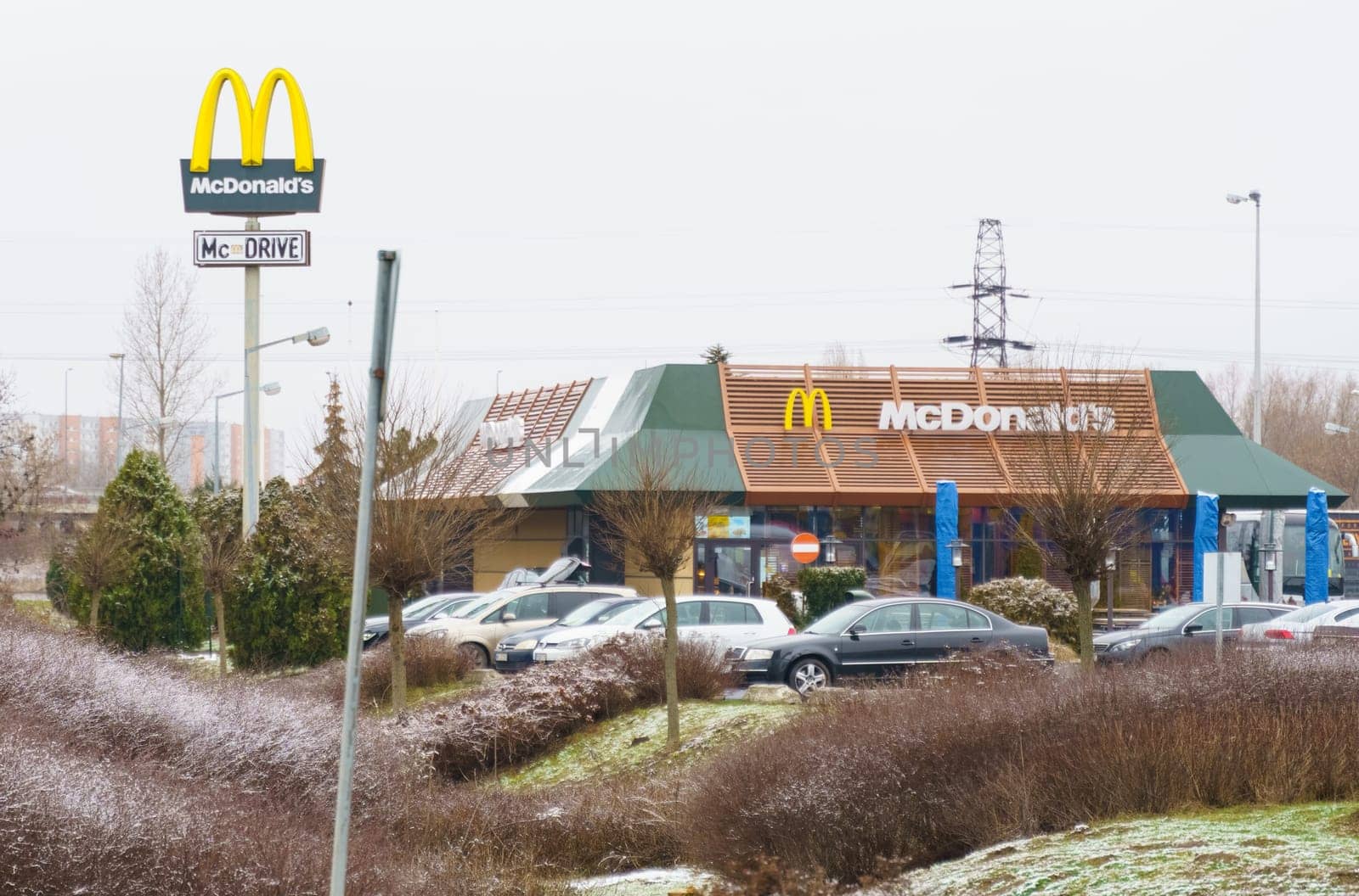 McDonald's restaurant building with logo and car parking in winter by Sd28DimoN_1976