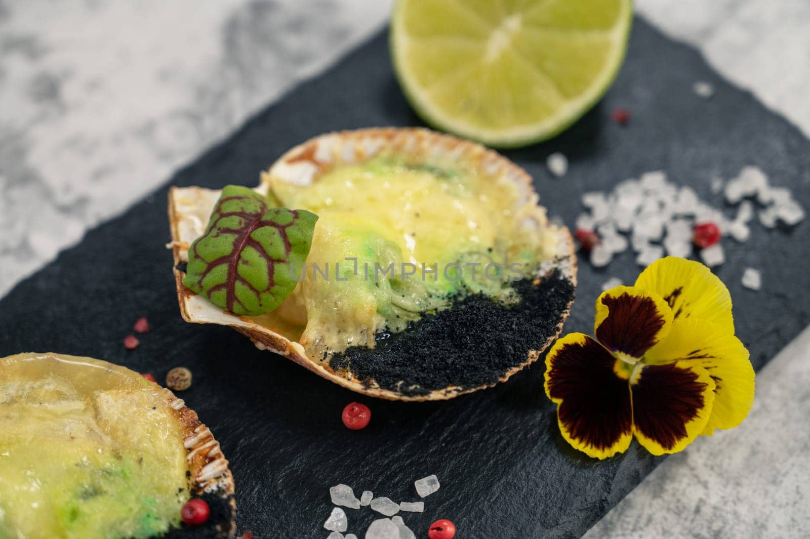 Delicacy roasted scallops with cheese spices and chuka algae