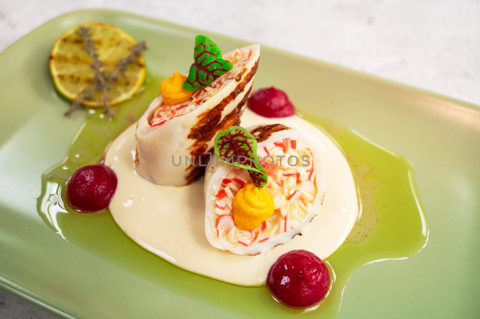 Squid stuffed with crab meat and cheese closeup dish