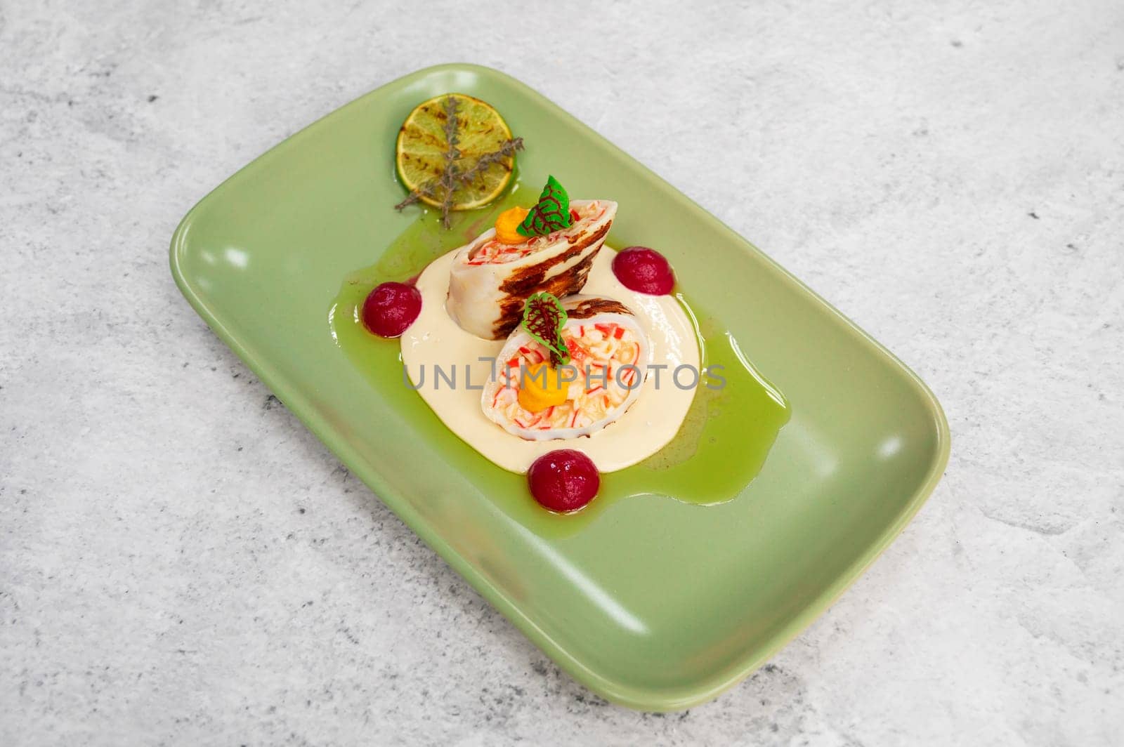 Squid stuffed with crab meat and cheese closeup dish
