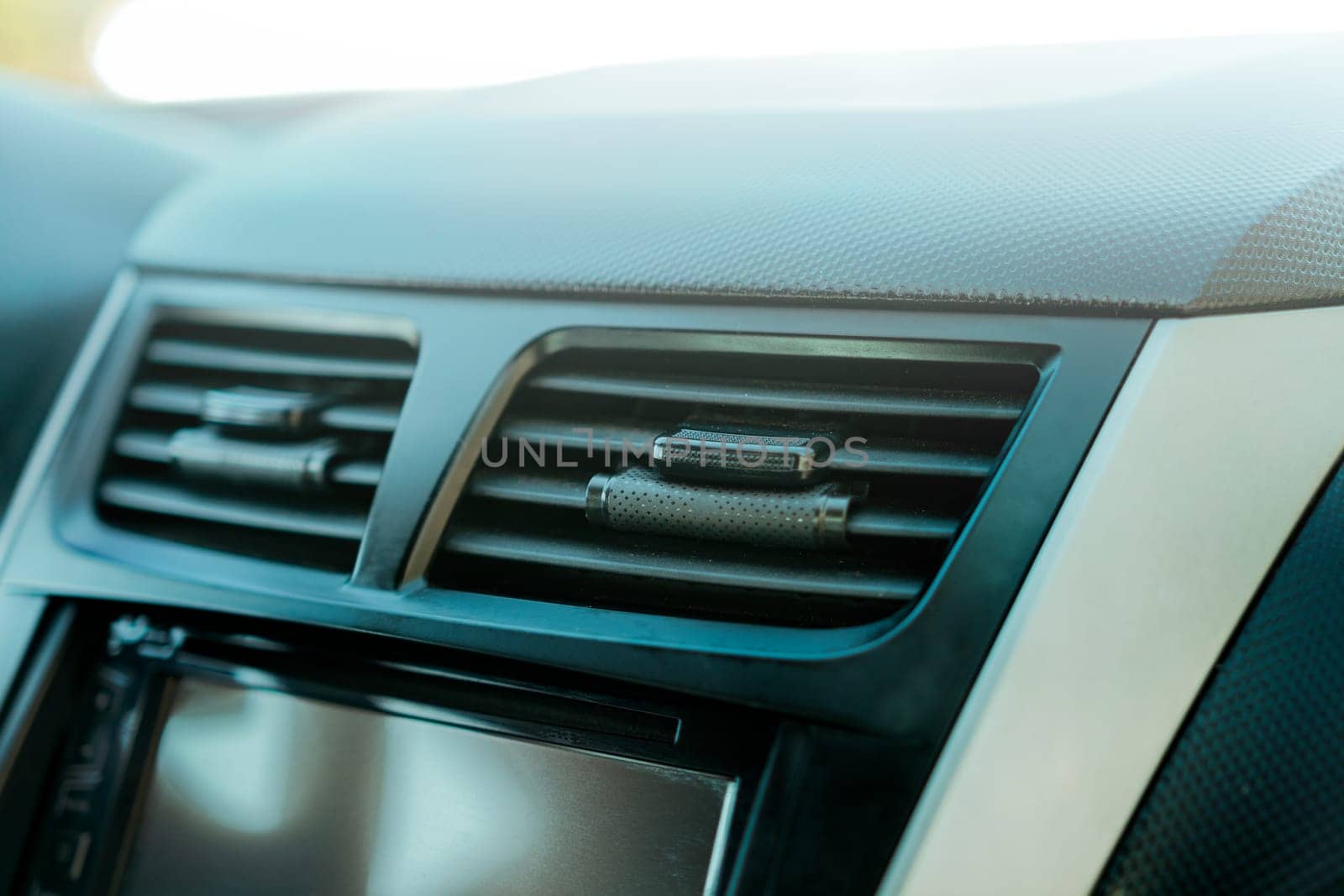 Close up of a car air conditioning panel. Air ventilation system of a car. Vehicle air conditioning window concept by isaiphoto