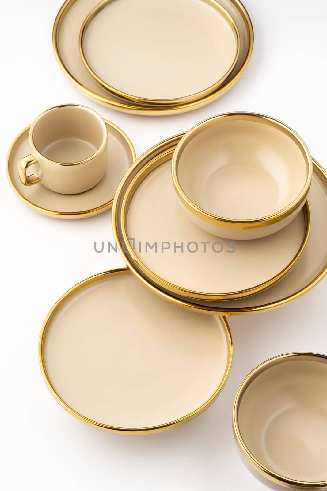 A Set of light brown ceramic plate and cup on a white background