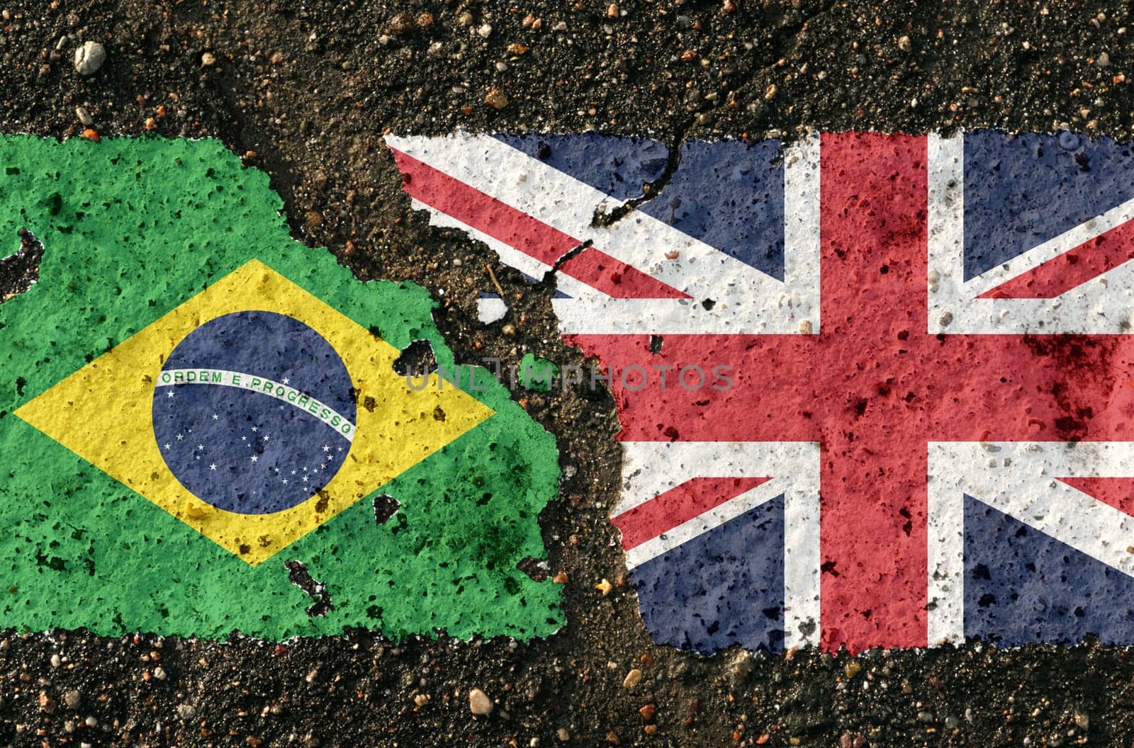 On the pavement there are images of the flags of Brazil and Great Britain, as a symbol of the confrontation between the two countries. Conceptual image.