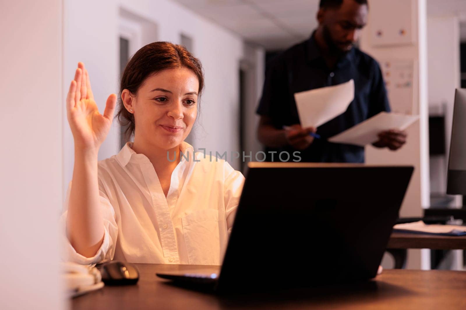 Smiling woman talking on videoconference, greeting colleague on videocall by DCStudio