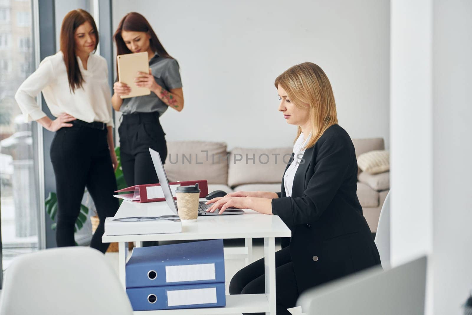 Group of people in official formal clothes that is indoors in the office by Standret