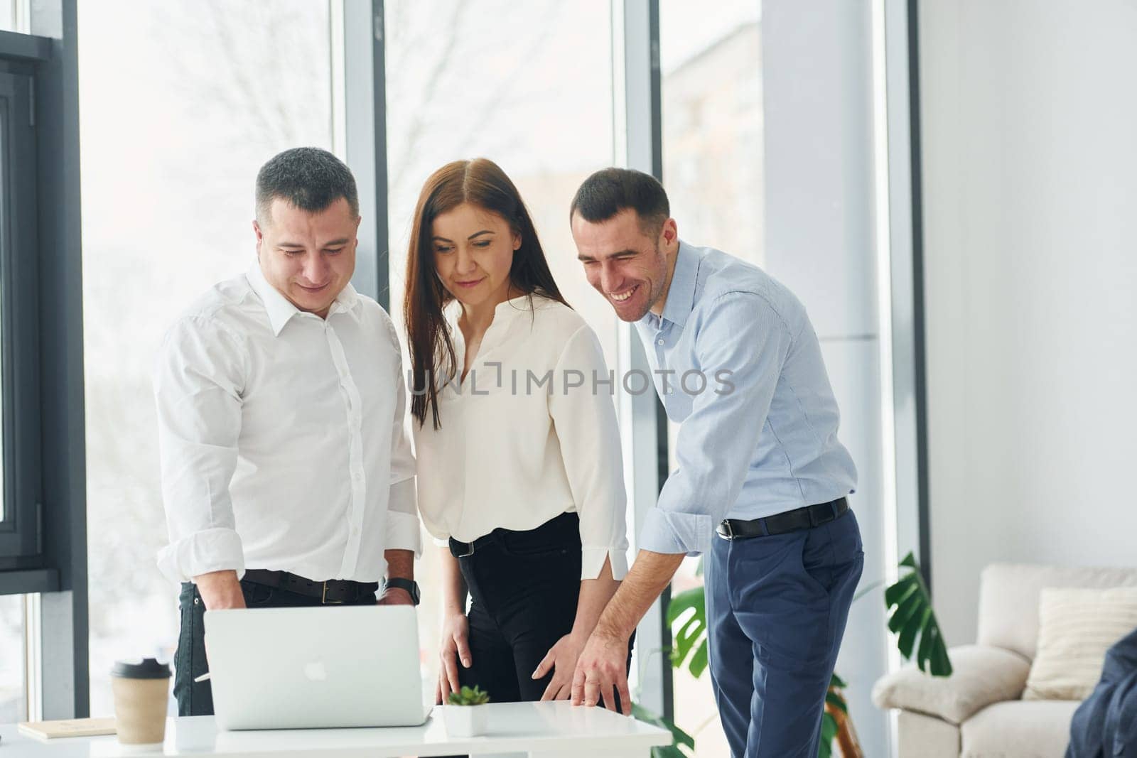 Group of people in official formal clothes that is indoors in the office by Standret