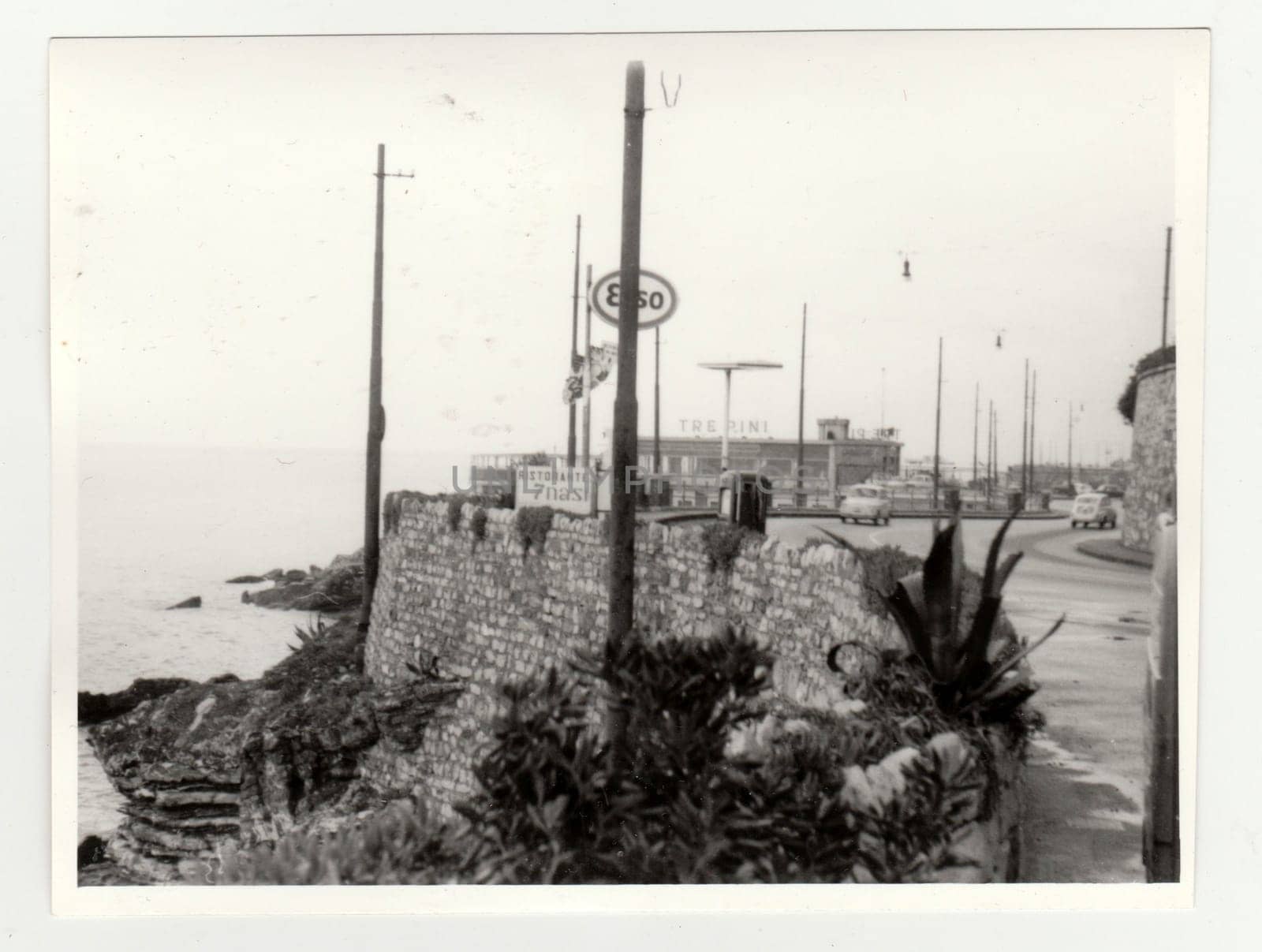Vintage photo shows the sea shore - the Italian riviera. Retro black and white photography. Circa 1970s. by roman_nerud