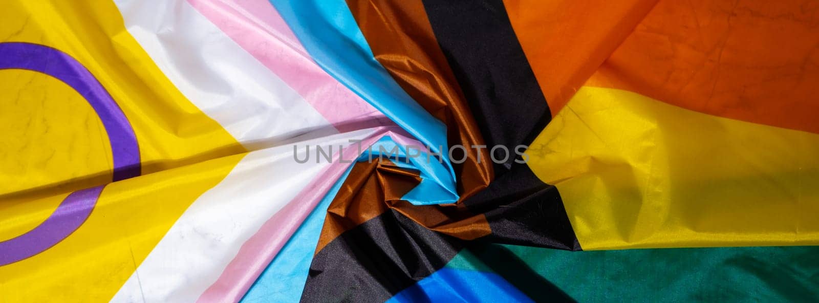 Banner Rainbow LGBTQIA flag made from silk material. Happy pride month. Symbol of LGBTQ pride month. Equal rights. Peace and freedom. Support LGBTQIA community. Diversity equality