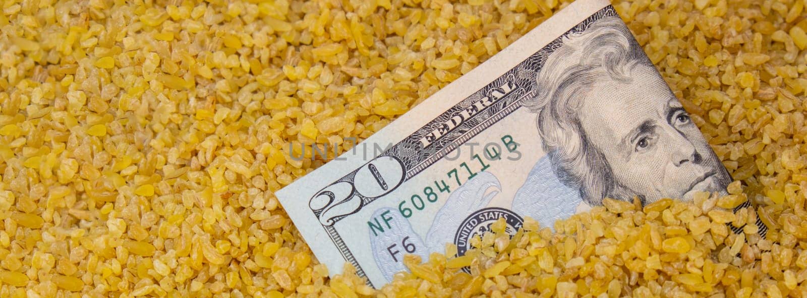US Dollar bill paper money currency banknote in buckwheat porridge. The crisis in the market of grain crops, the rise in prices or production volumes of buckwheat Food and groceries shopping price increase, Rising food cost food crisis inflation concept.