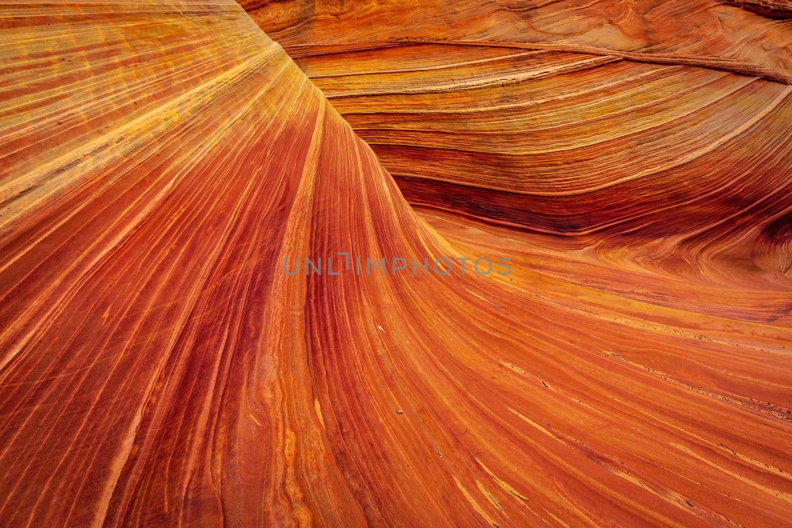 The Wave is a famous sandstone rock formation located in Coyote Buttes, Arizona, known for its colorful, undulating forms