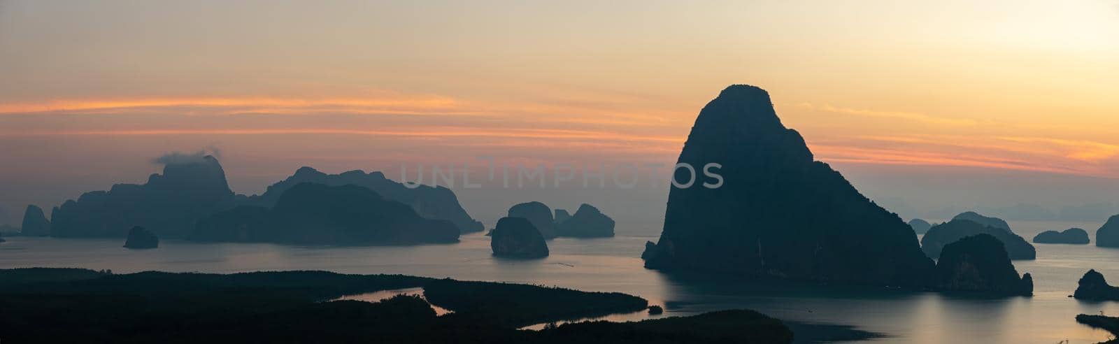 Panorama Morning sunrise. Mountains in the Andaman Sea. March 2019: Samed Nang Phi Phang Nga, Thailand
