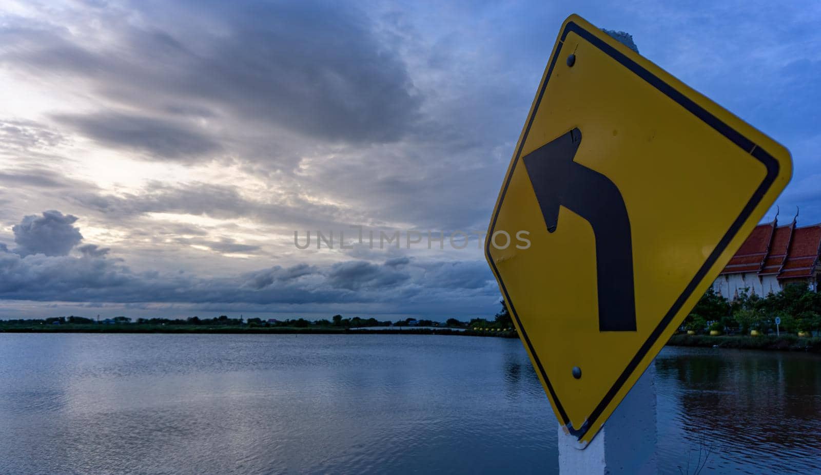 The signs on the left curve point towards the clouds.
The sky after the sunset