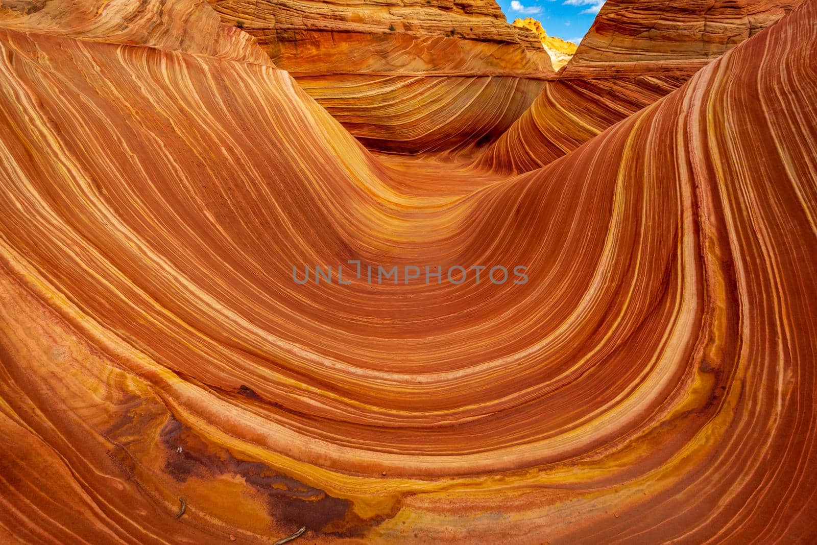 The Wave is a famous sandstone rock formation located in Coyote Buttes, Arizona, known for its colorful, undulating forms