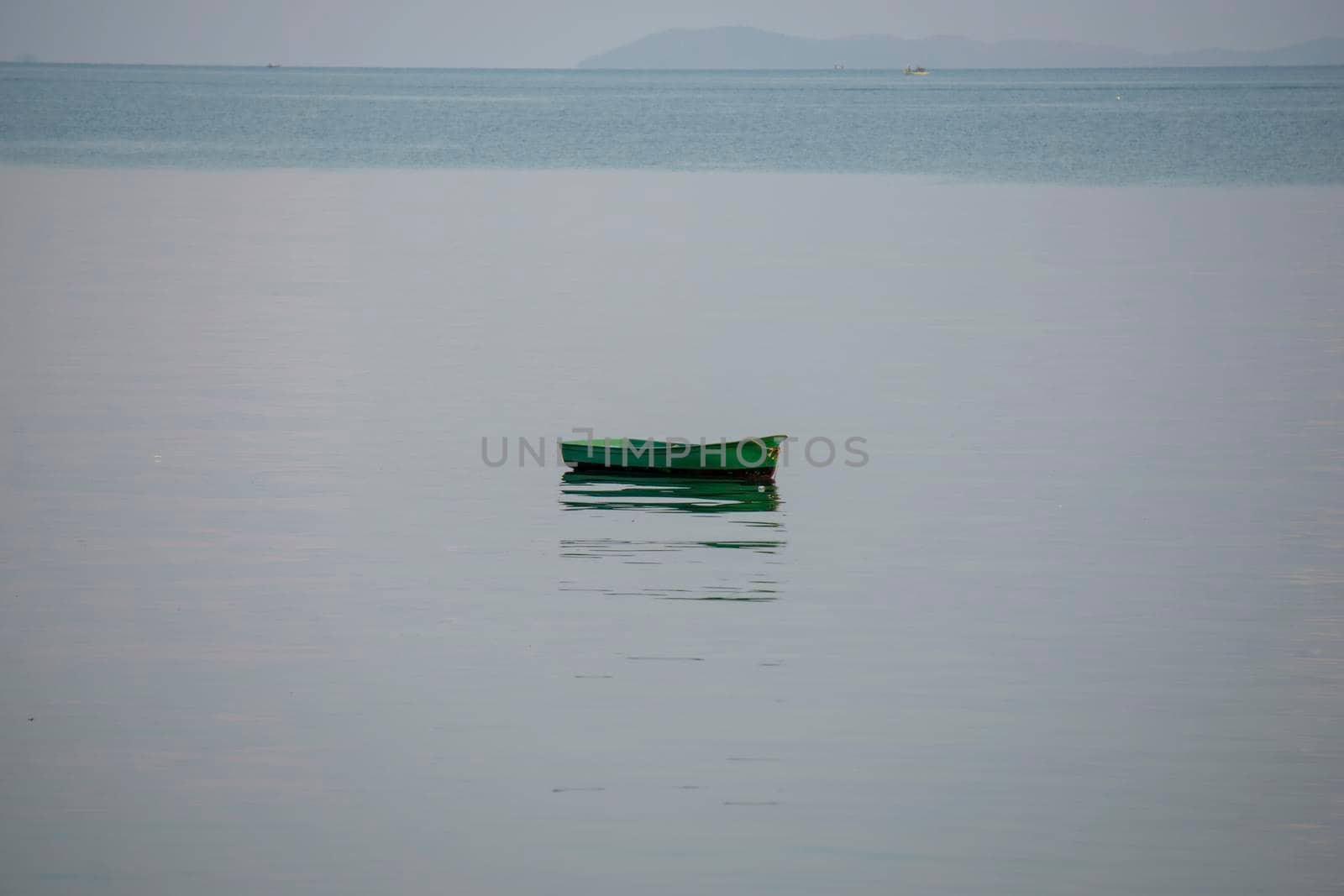 A small fishing boat is anchored. Stop back from Fishing near the coast