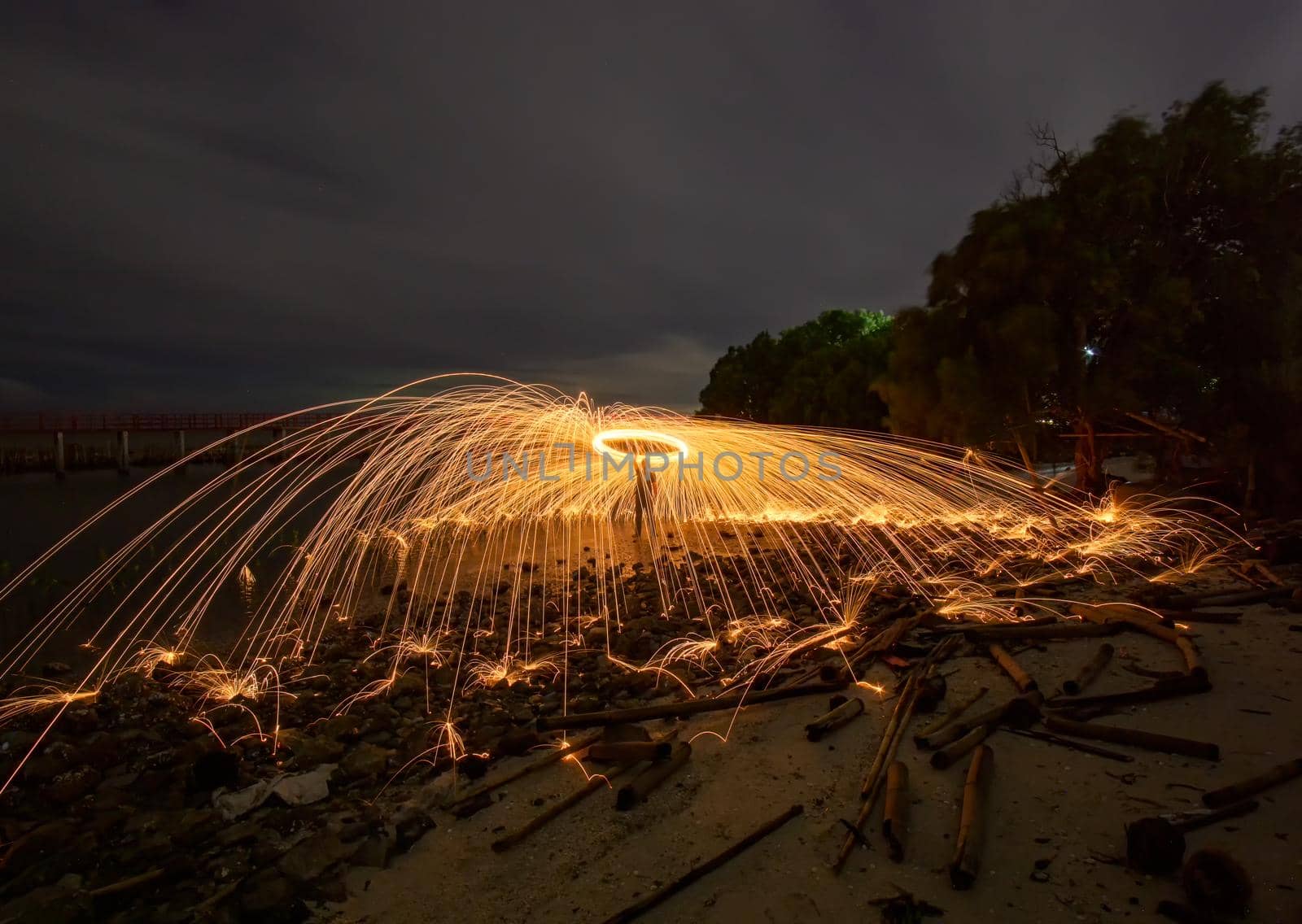 Playing with flames Holding a fire to cause flakes