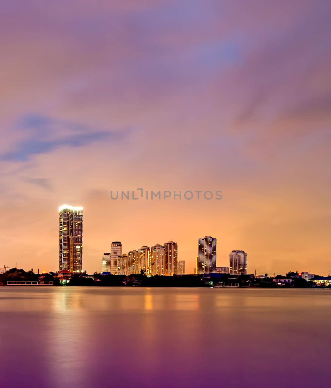 The small town near the river In the evening on a cloudy day