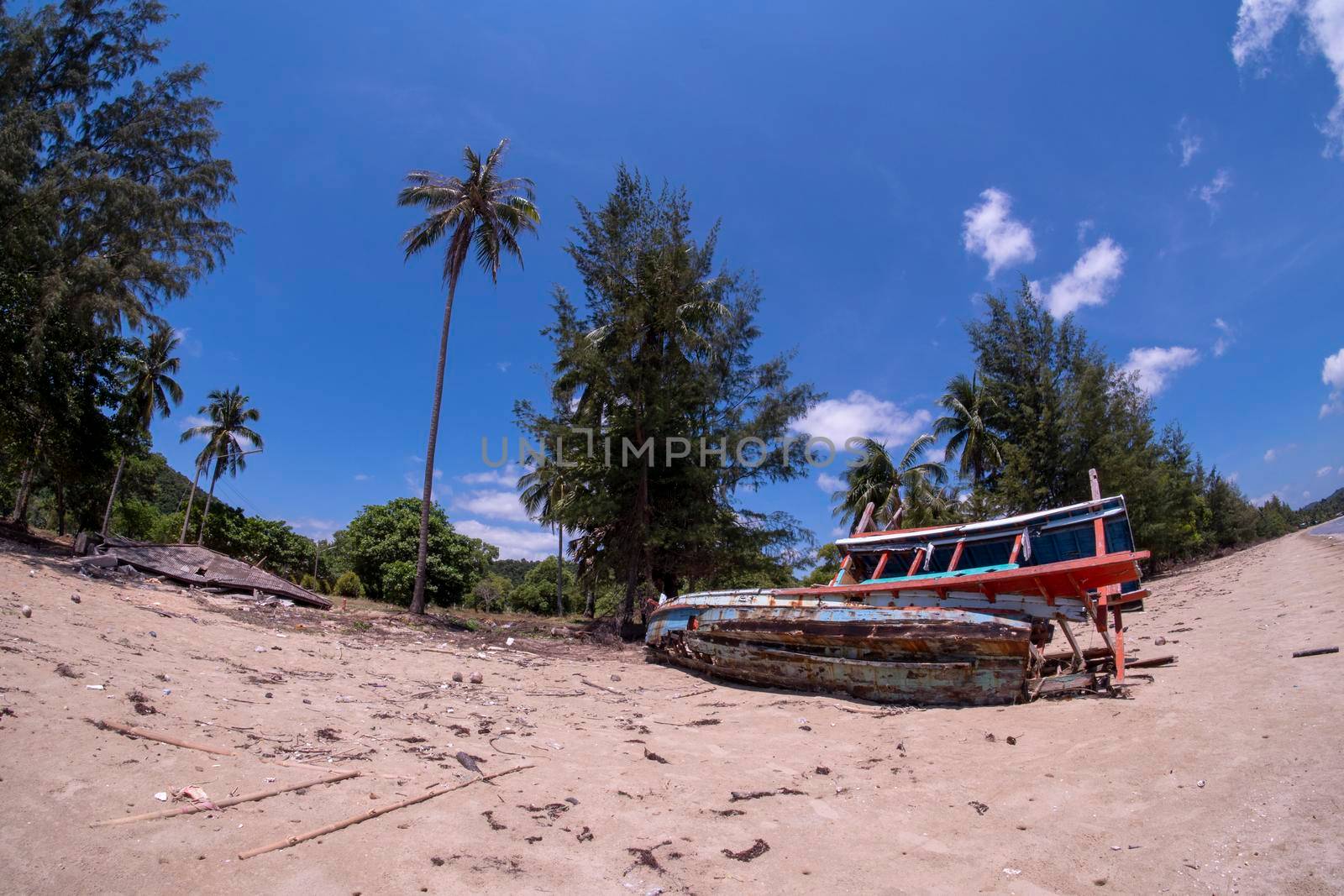 Houses and fishing boats are damaged. Fishing boats are not available on the beach. House collapsed