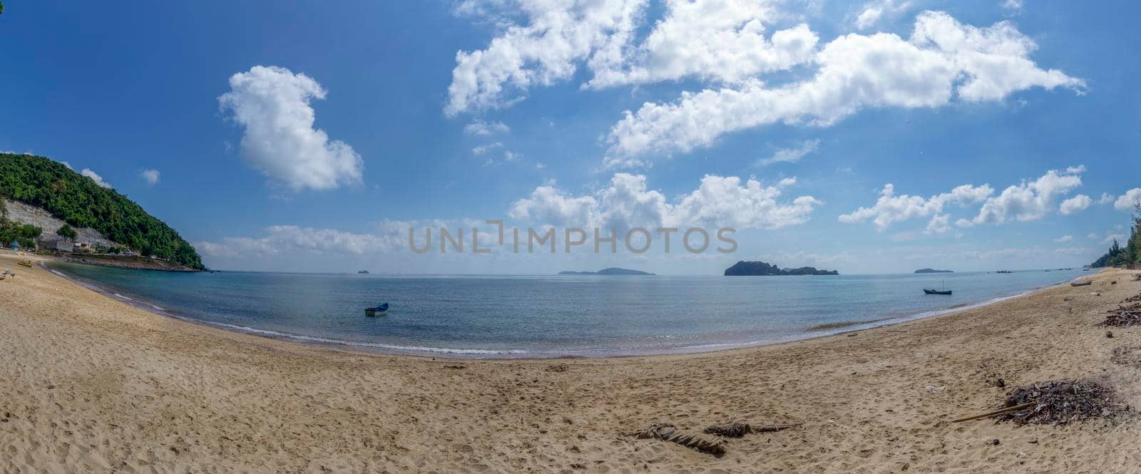 The sea and the beach at noon. The bright sky, the clouds are white.​Sea atmosphere at Sairee Beach, Chumphon Province, March 2019