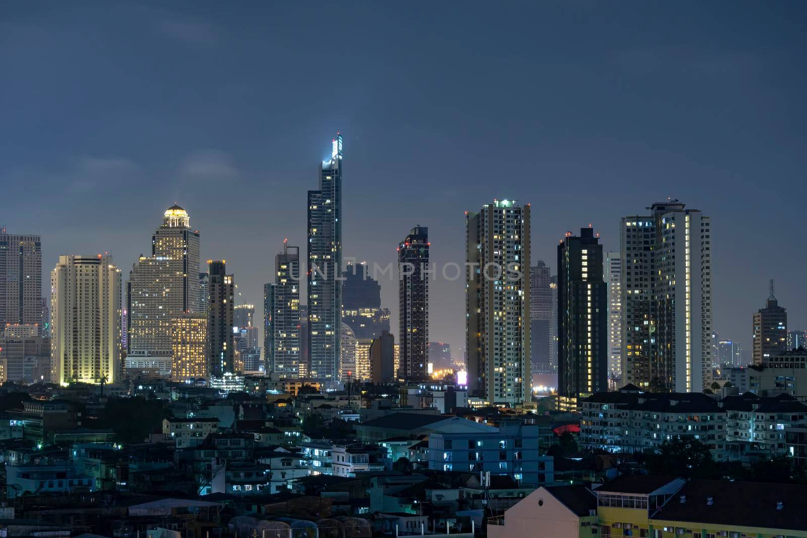 High-rise building in the capital city of Thailand Bangkok office area Night light from the building	
