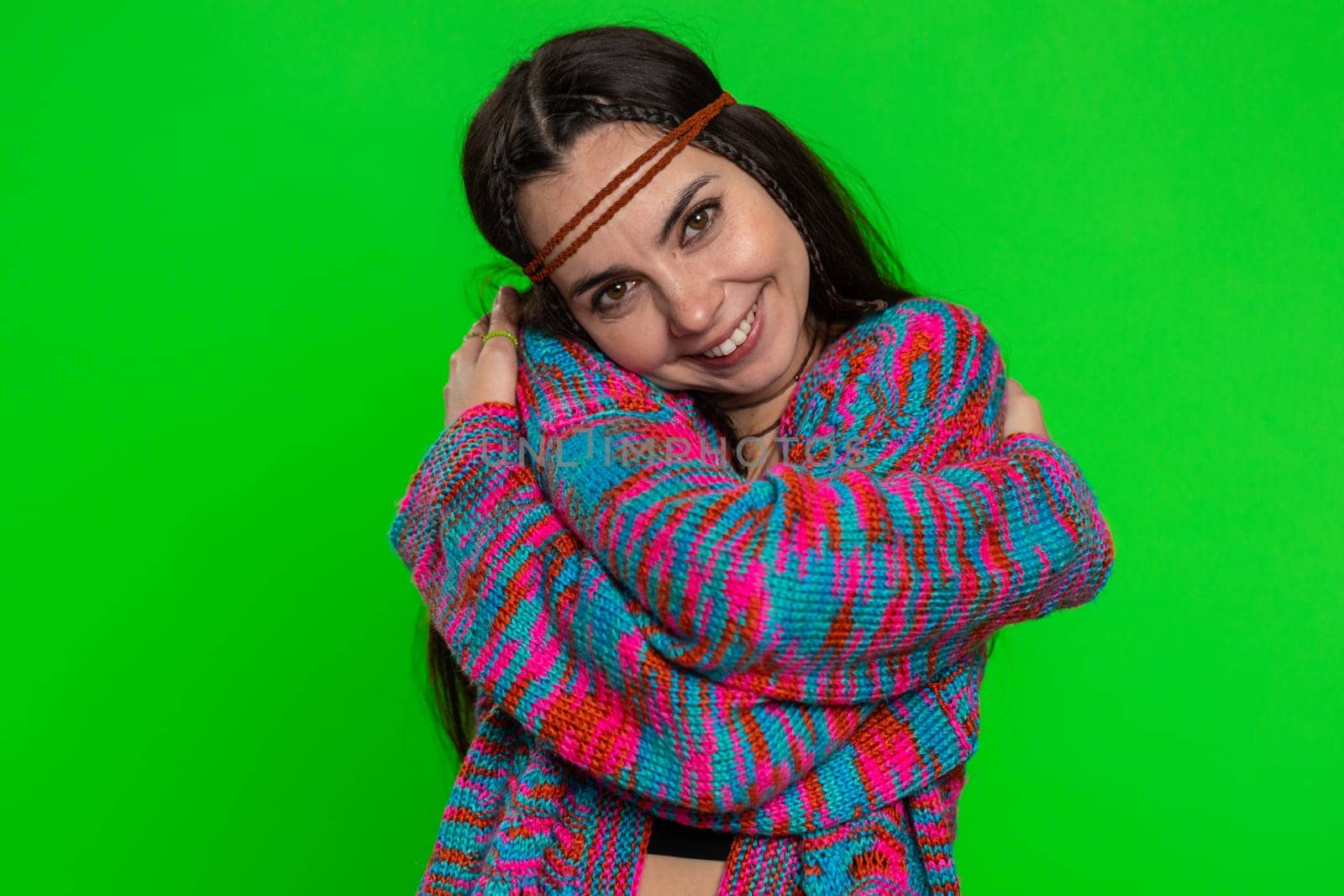 Come to me I want to embrace you. Young happy woman spread hands and give hug to you, invite. Pleasant expression love feelings. Hippie girl isolated on chroma key background, green screen, indoors