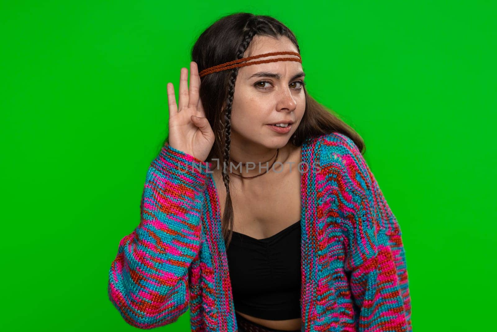 I cant hear you. What. Young woman trying hear, looking confused, frowning, keeping arm near ear for louder voice, asking to repeat, to hear information, deafness. Girl on green chroma key background