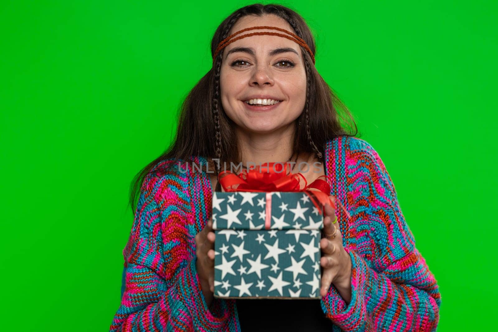 Positive smiling young woman presenting birthday green gift box stretches out hands, offer wrapped present career bonus, celebrating party, sale. Girl isolated on chroma key background, green screen