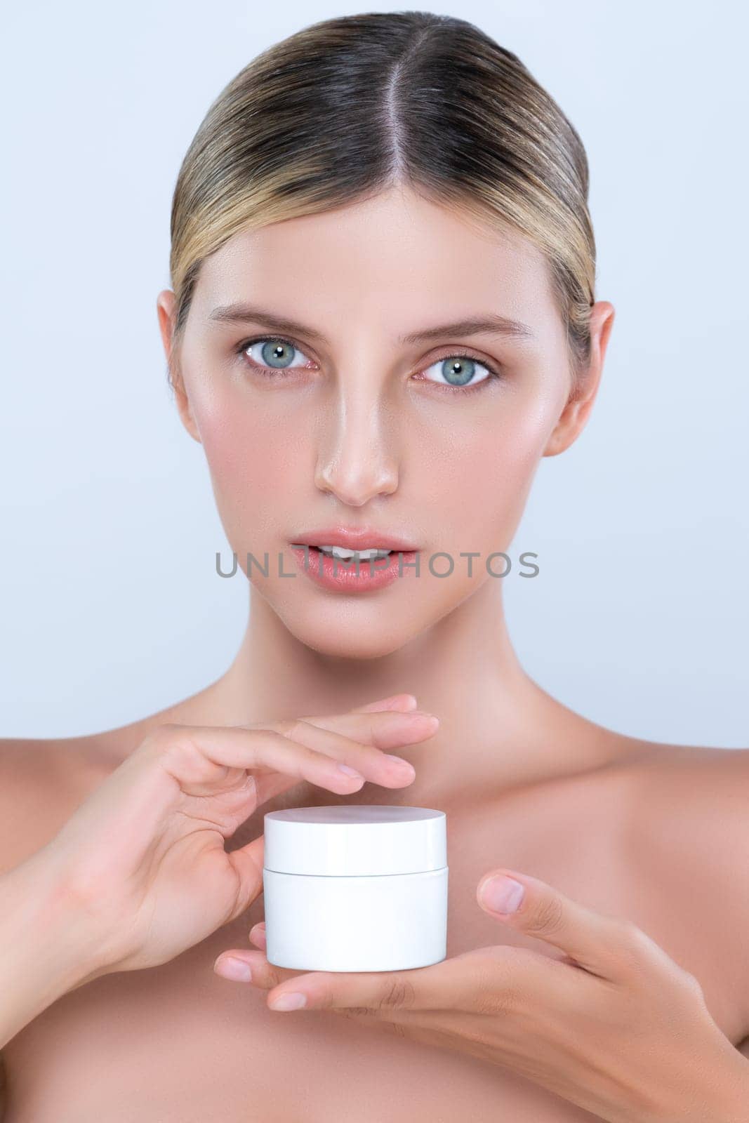 Alluring beautiful perfect cosmetic skin woman portrait hold mockup jar cream or moisturizer for skincare treatment, anti-aging product in isolated background. Natural healthy skin model concept.