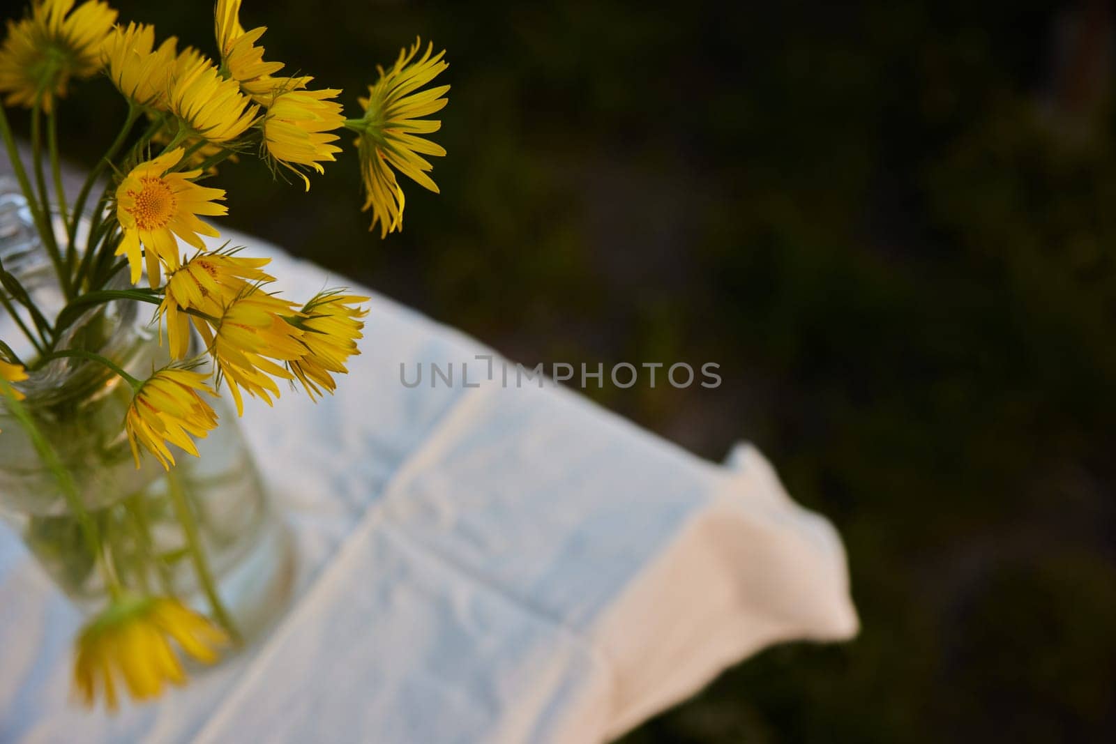 top view of a bouquet of yellow flowers standing on the street. High quality photo