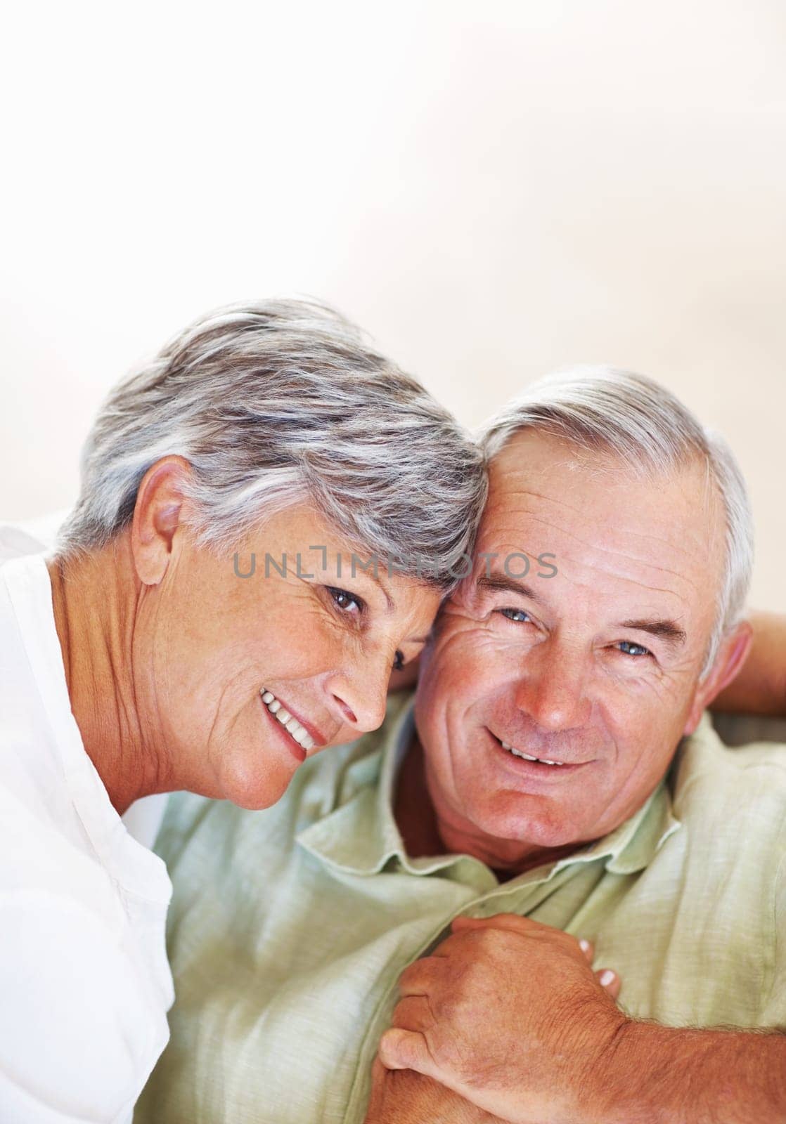 Mature couple spending romantic time together. Smiling mature couple spending romantic time together at home