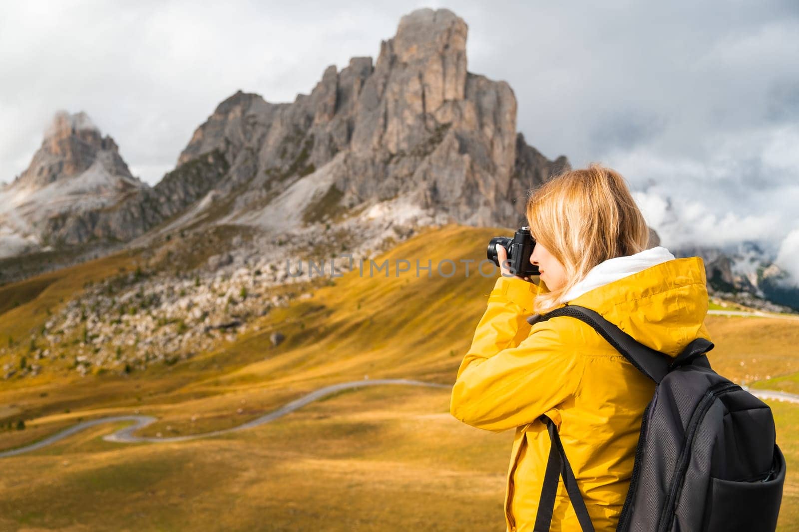 Professional photographer takes pictures of Passo Giau pass by vladimka