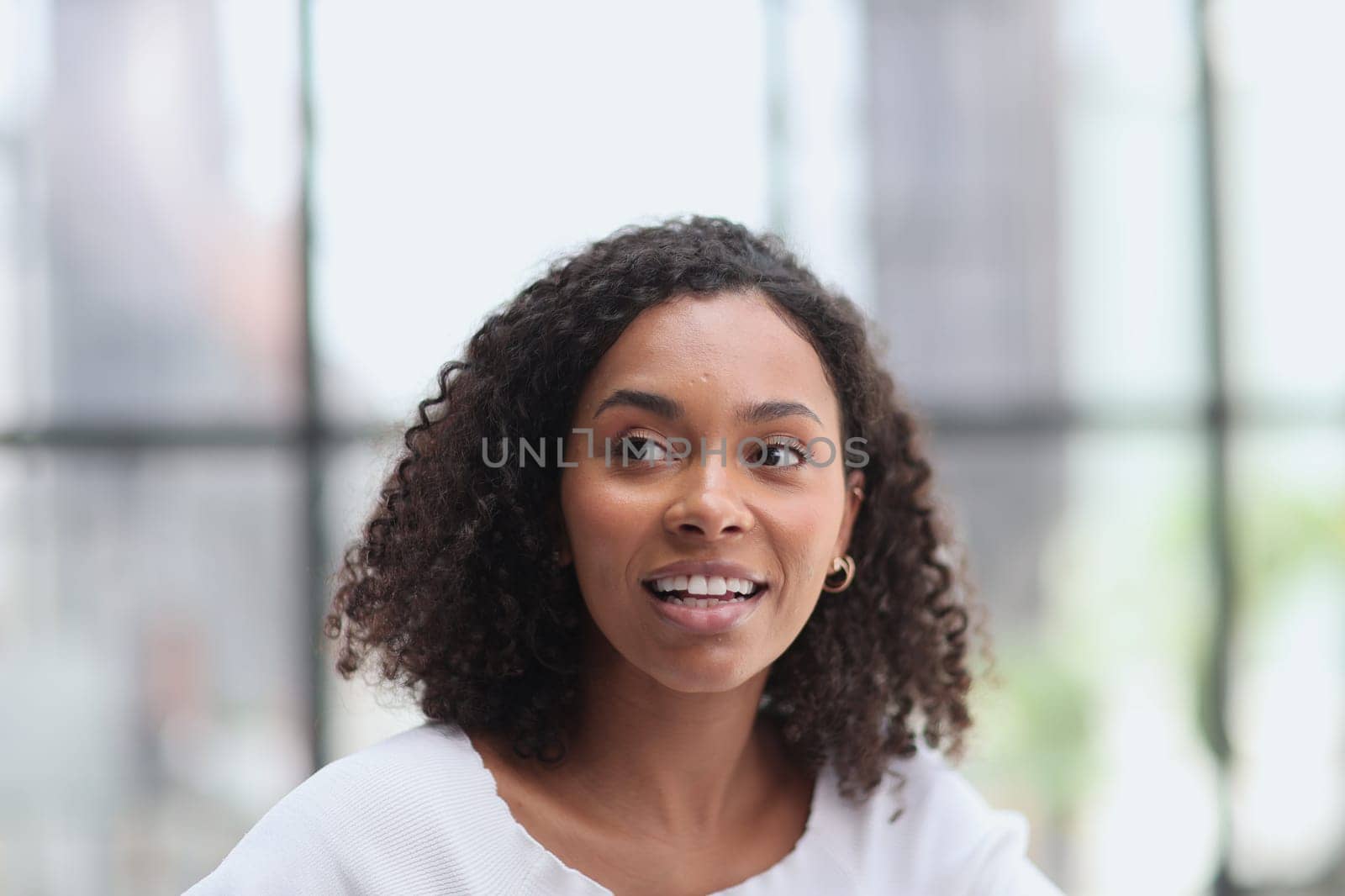 Beautiful female african american business woman CEO in a suit at the workplace