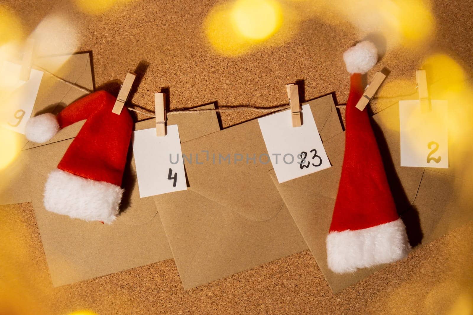 Original Advent Calendar made of envelopes in earth tones recycling eco zero waste concept for Christmas Homemade. Preparation to Christmas concept. Family winter holidays. Eco friendly presents gifts. open the package every day DIY acts of kindness