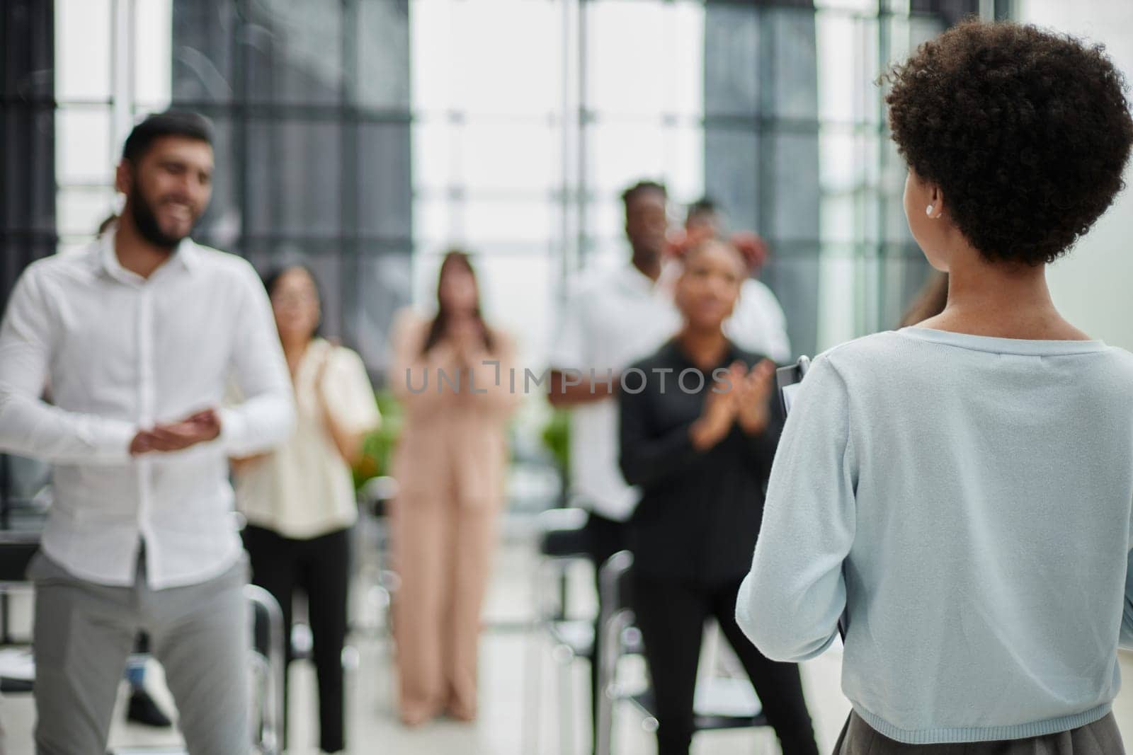 Young woman coach speaker giving flipchart presentation