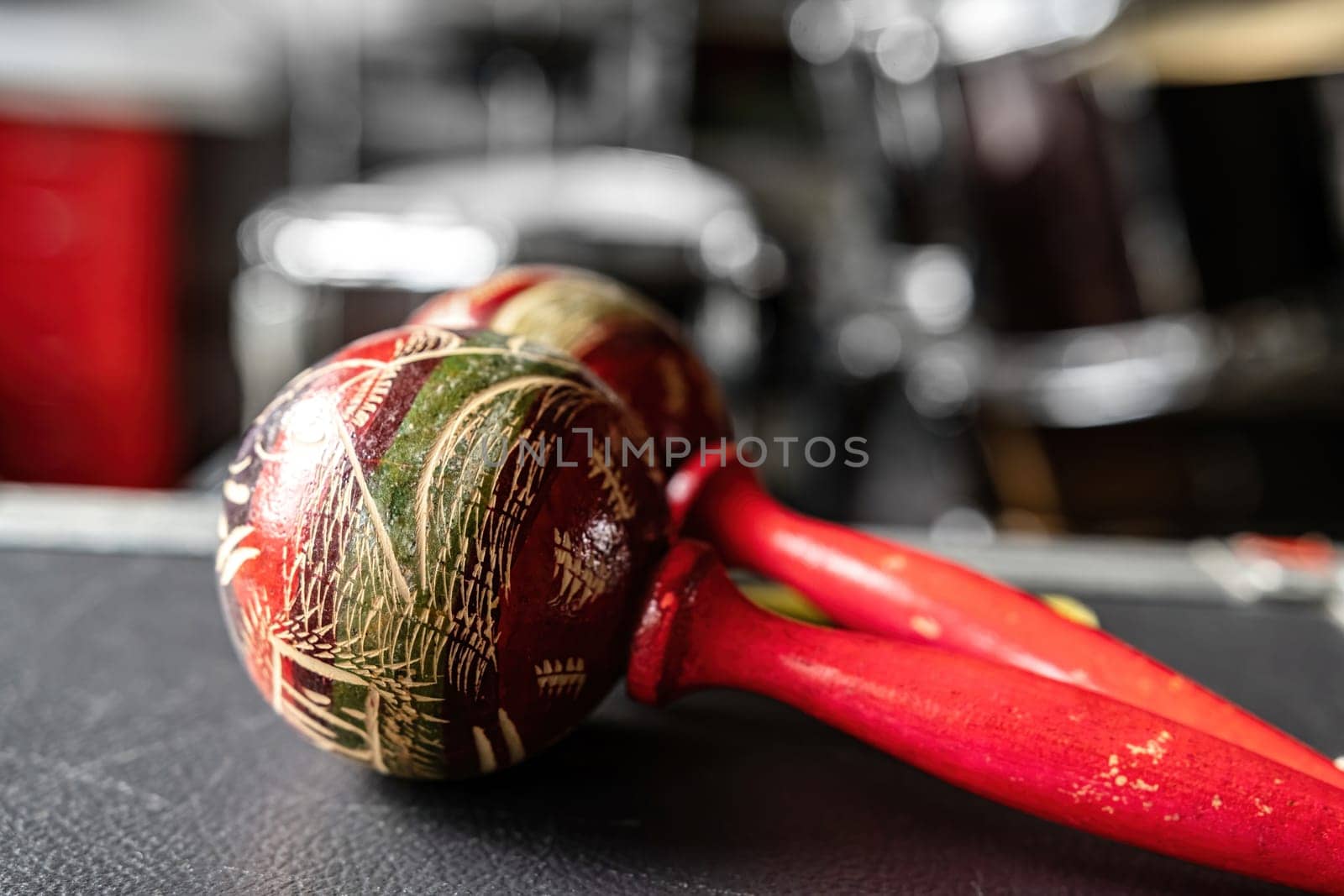 Colorful maracas for hispanic music on table in recording studio closeup. Traditional shaking musical instrument for ethnic perfomance
