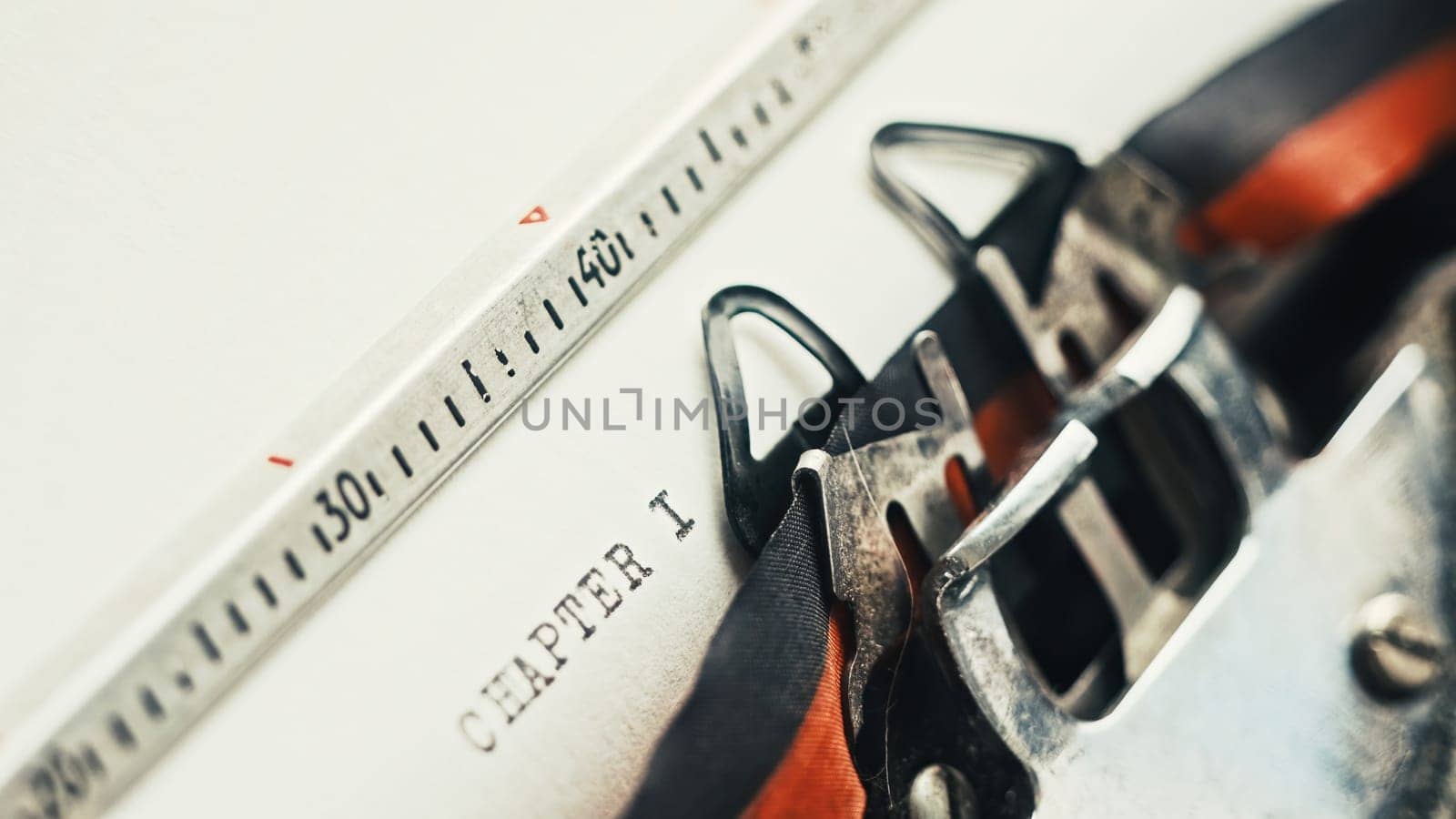 Vintage typewriter typing text Chapter One, close up view