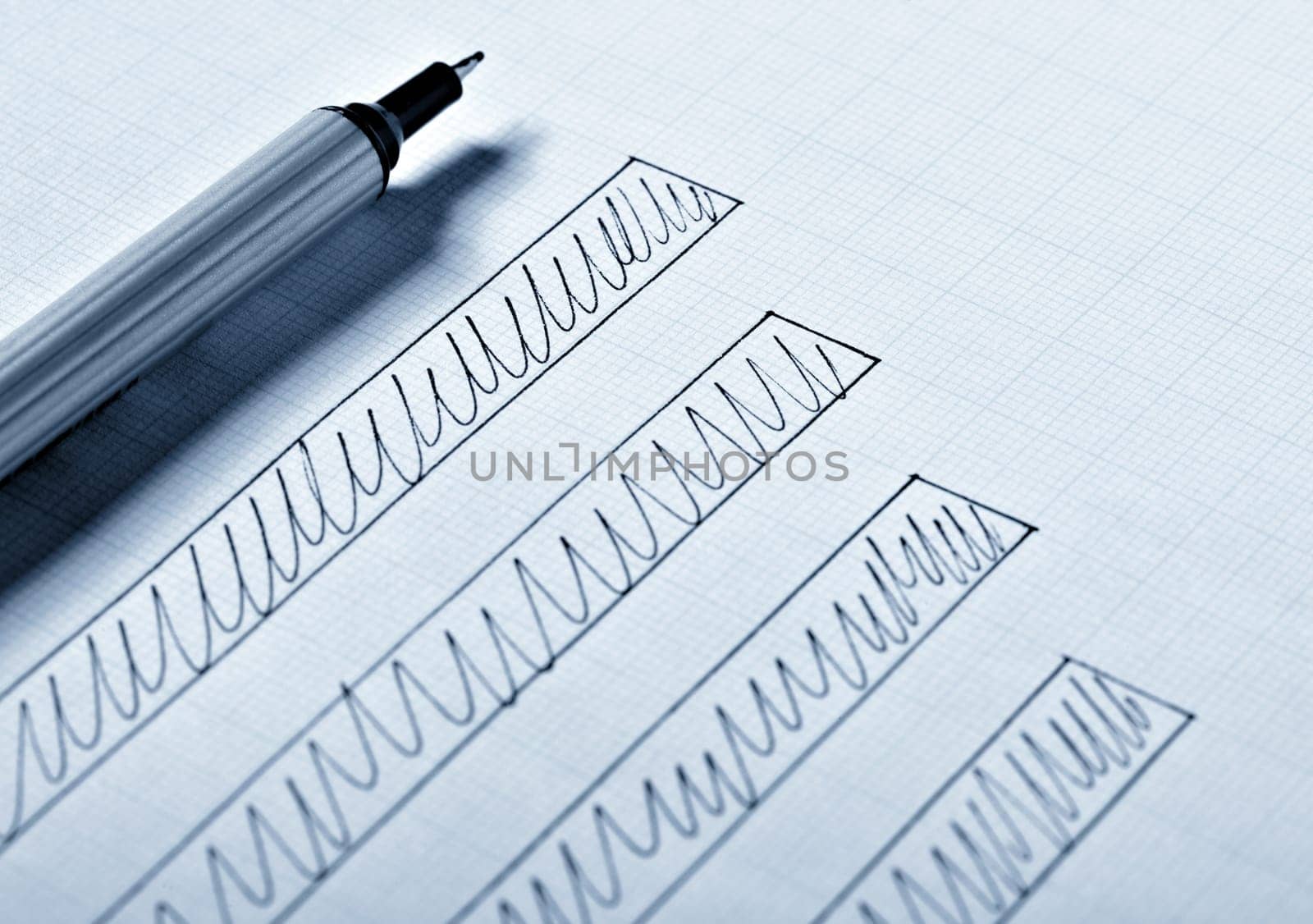 close up of a business finance graph, papers and pencil